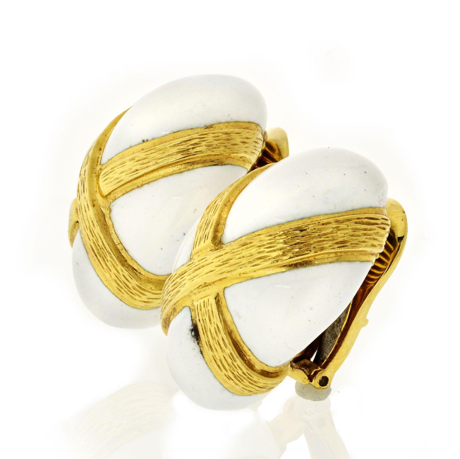 18 karat yellow gold white enamel clip earrings Signed David Webb. With a textured gold accros in an X. 
Clips measure: 23mm long. L: 23mm, W: 16mm
