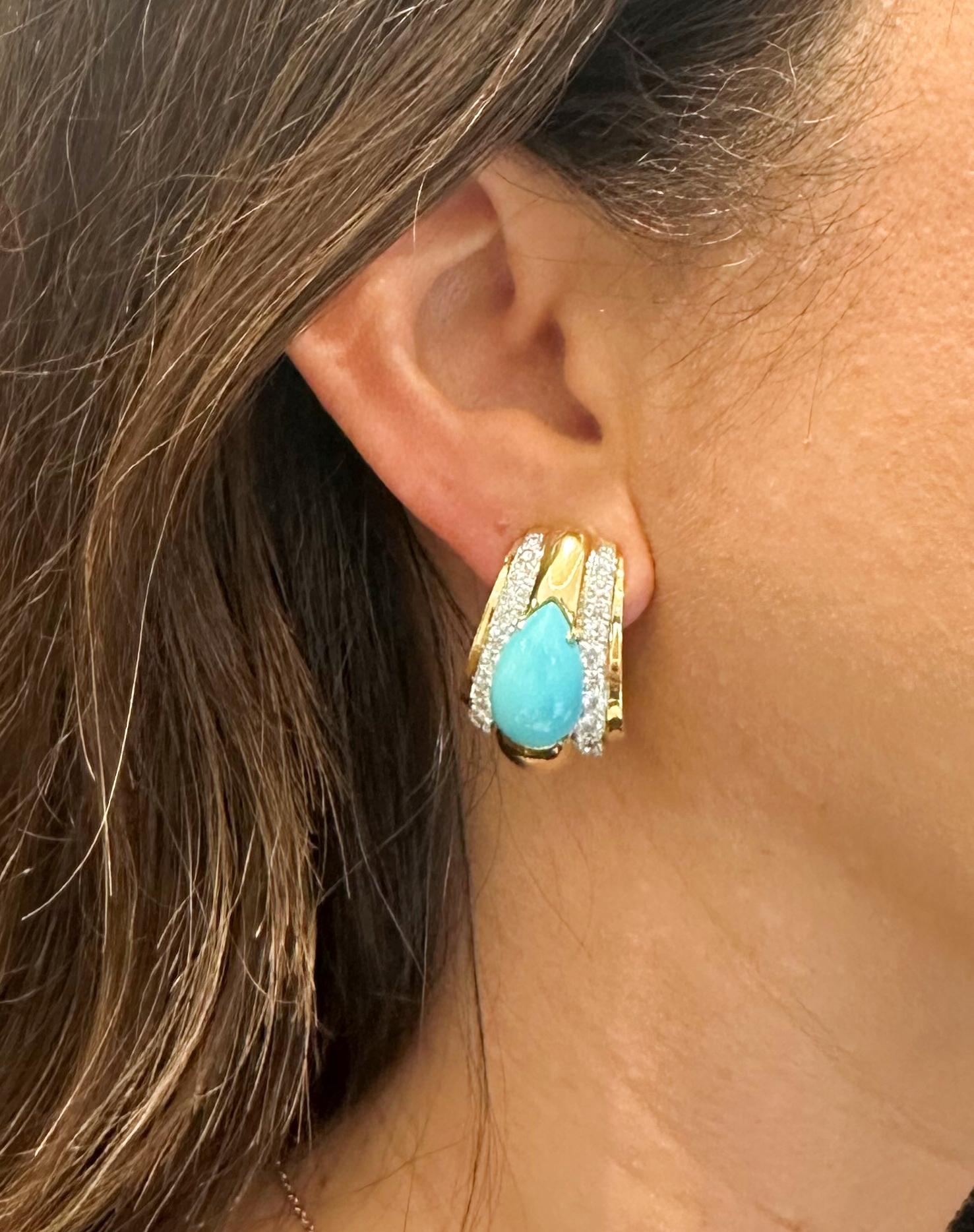 From designer David Webb, 18 karat yellow gold and platinum turquoise and diamond half hoop clip earrings. These earrings are crafted with 2 pear shape cabochon cut turquoise stones in the center of the half hoops. Additionally, 2 row of 48