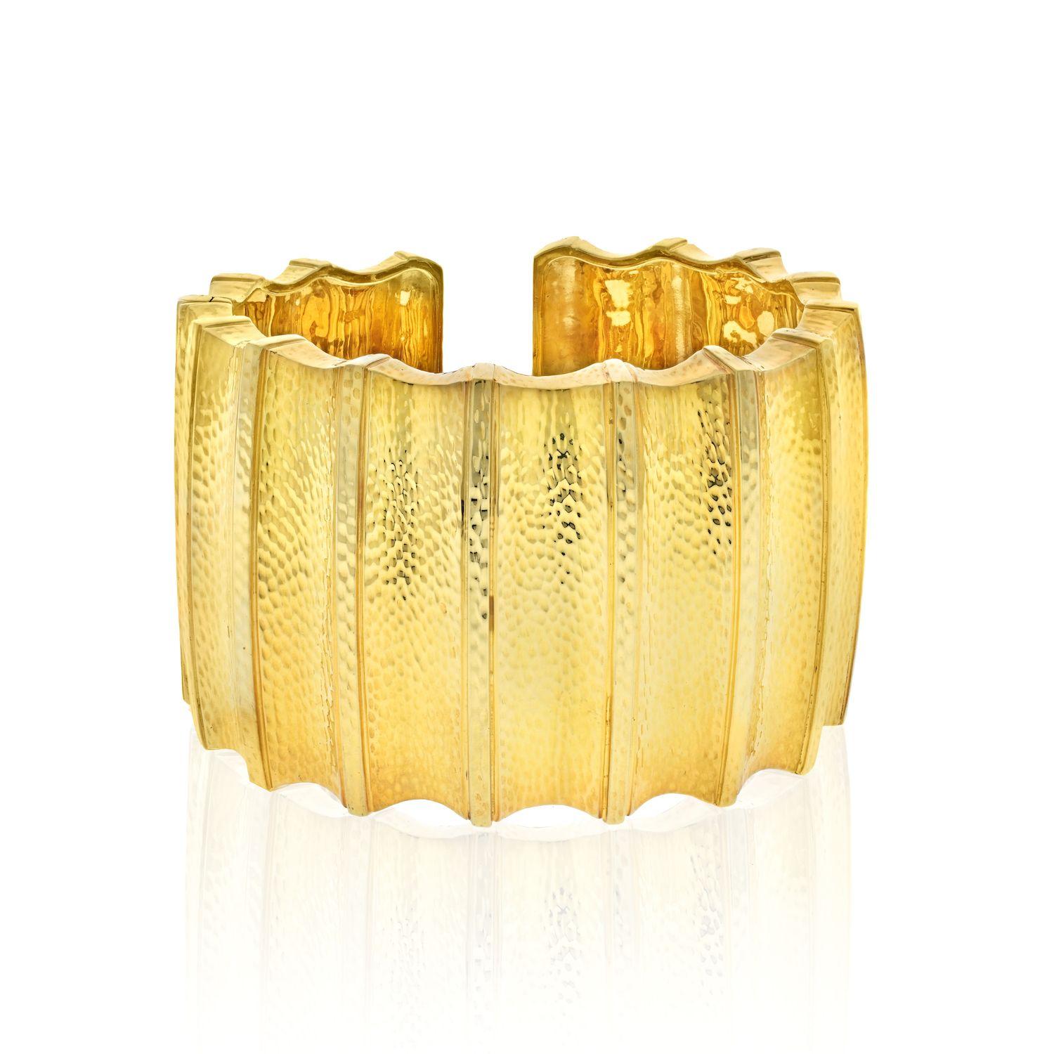 Dress your wrist in this glowing statement maker. The Ridge Cuff from The Ancient World collection by David Webb is an exciting and wearable piece of jewelry. It is a hinged cuff and is easy to open and close. It is anout 2 inches wide and is a