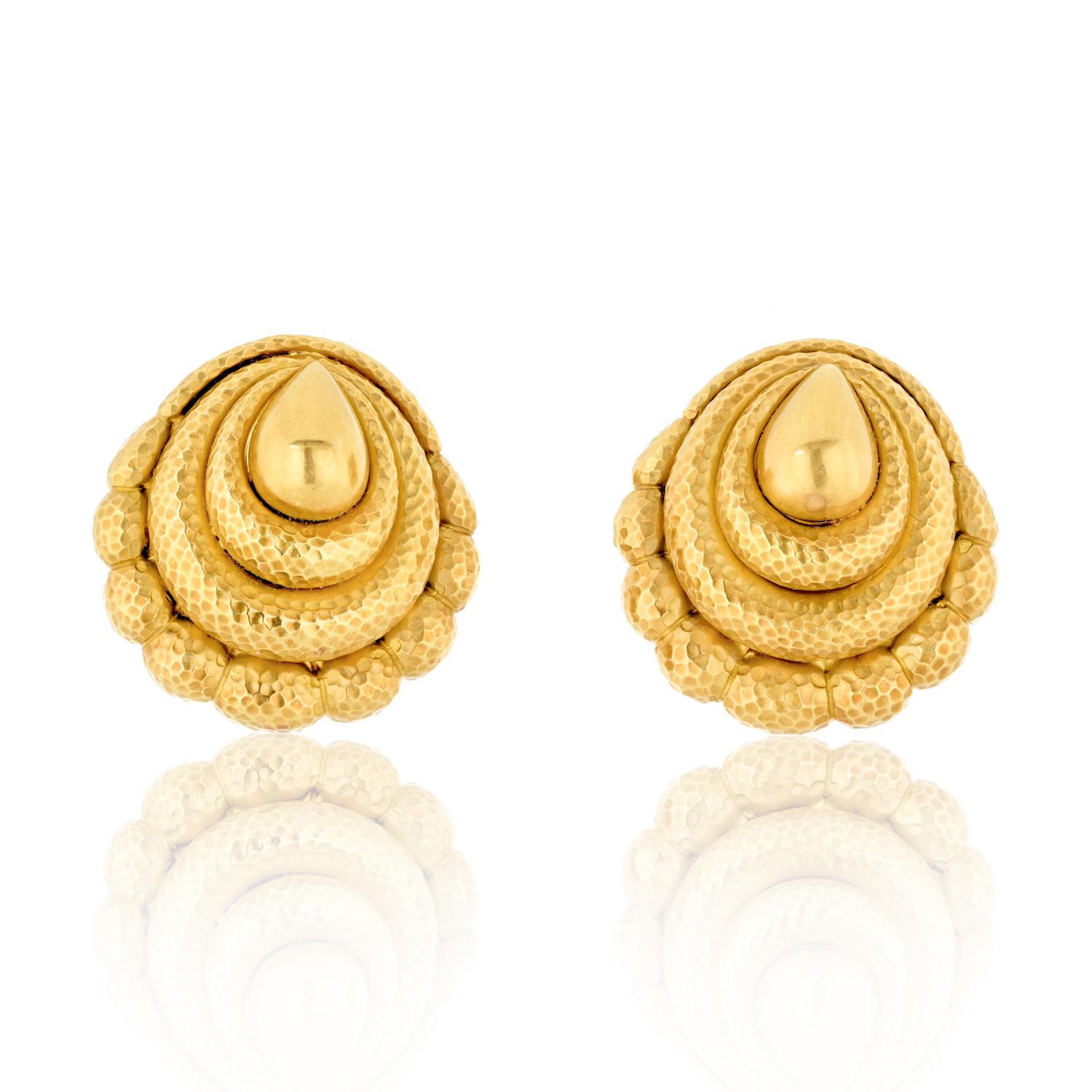 Step into the world of vintage elegance with the David Webb 18K Yellow Gold Hammered Scroll Earrings, a pair of timeless accessories that showcase the brand's signature craftsmanship and design.

**Key Features:**

1. **Material:**
   - Crafted in