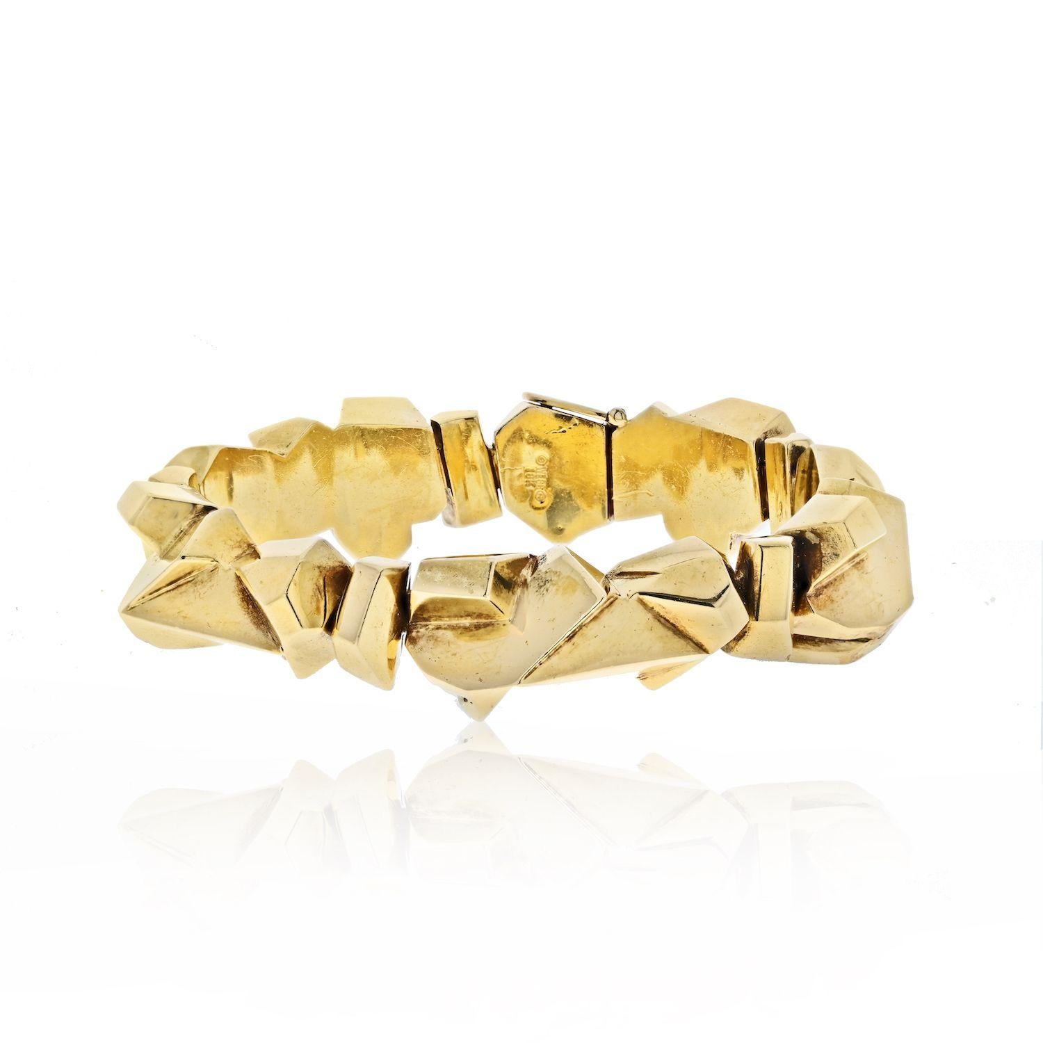 This is an articulated yellow gold ski slope nugget bracelet by David Webb. Comes with the certificate from David Webb.
Wrist size circumference: 8 inches. 
The bracelets can be paired with the D.Webb matching earrings. 
The earrings are sold