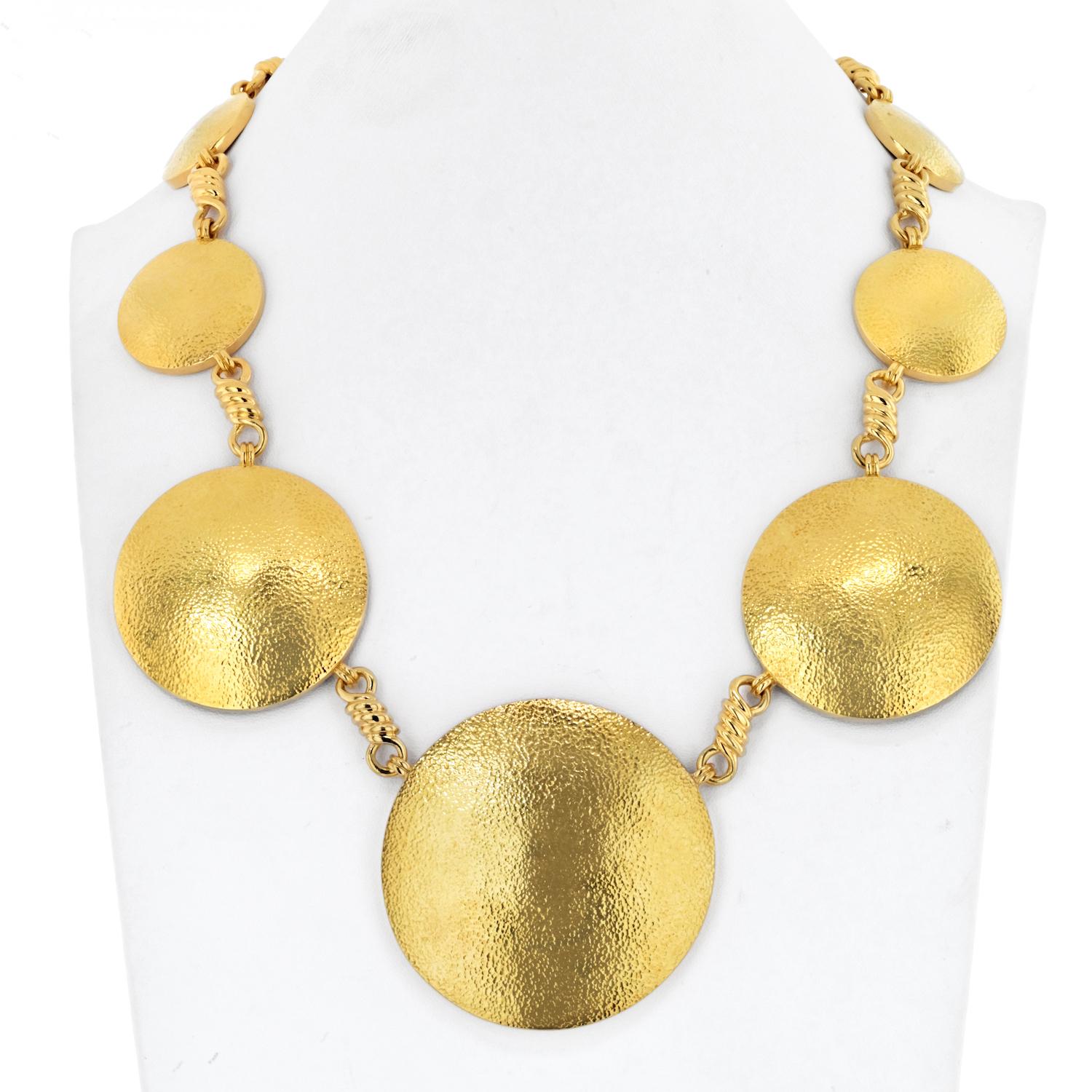 Immerse yourself in the radiance of the David Webb 18K Yellow Gold Solar Disc Necklace, a captivating piece designed with meticulous craftsmanship and a bold display of graduated discs.

**Key Features:**

1. **Material:**
   - Crafted in opulent