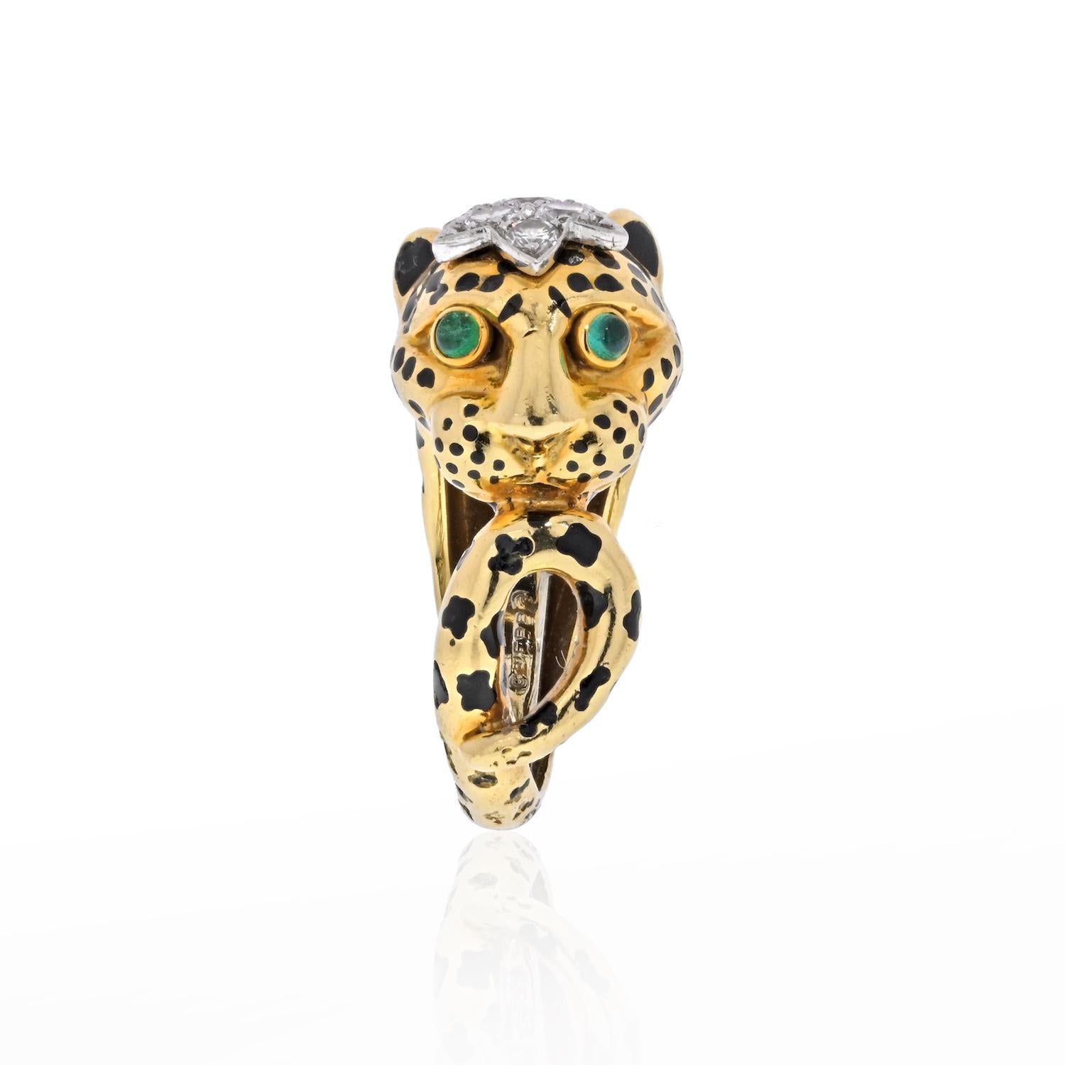 Designed as a sweet little Leopard facing sideways, decorated with black enamel spots and circular-cut cabochon emeralds as eyes. Emeralds weighing 0.15 total carats. His head is encrusted with round cut diamonds of about 0.20cttw. 

Measurements: