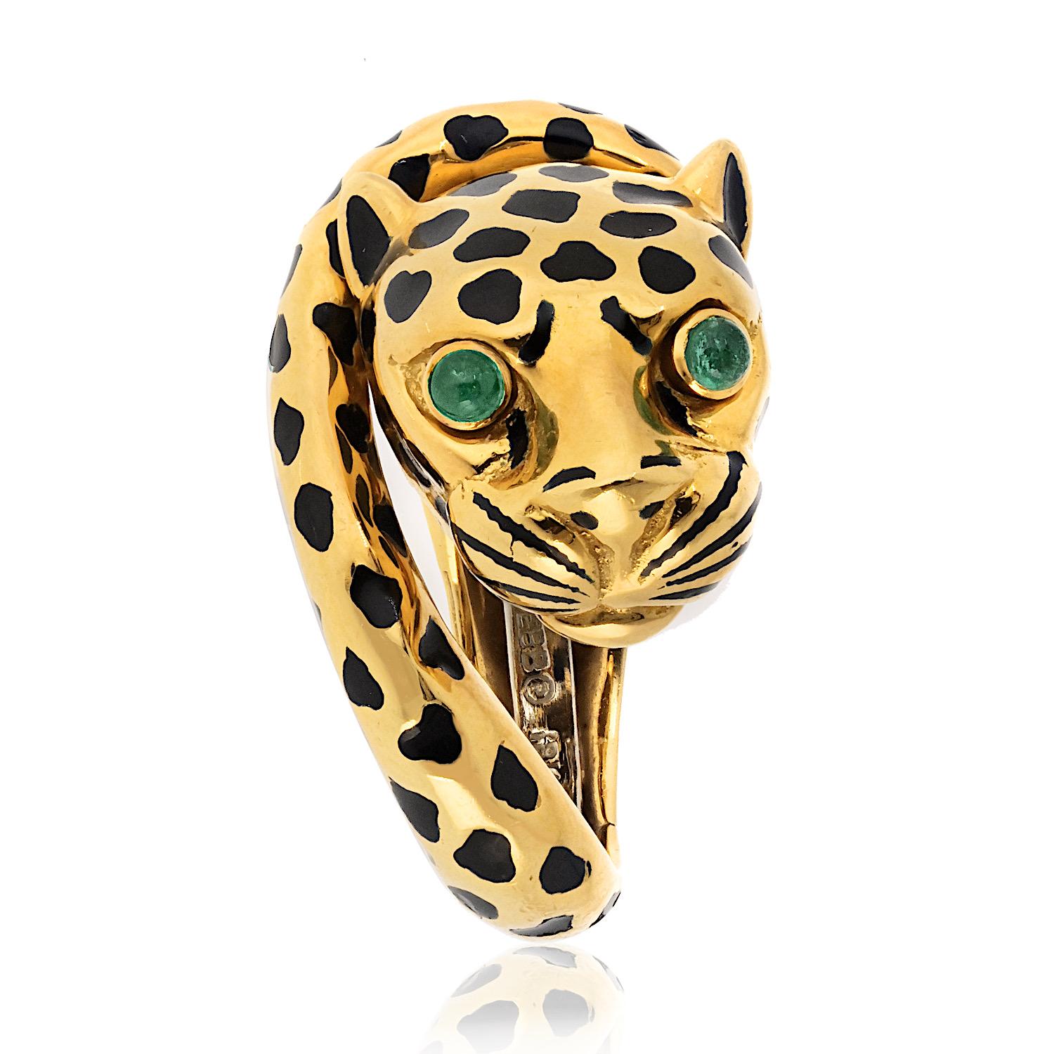 Original David Webb Tiger Ring with green emeralds, and black enamel.

The Tiger ring by David Webb is an iconic piece of jewelry. The ring features a tiger's head made of 18K yellow gold with green emerald eyes, and black laquer spots over its'