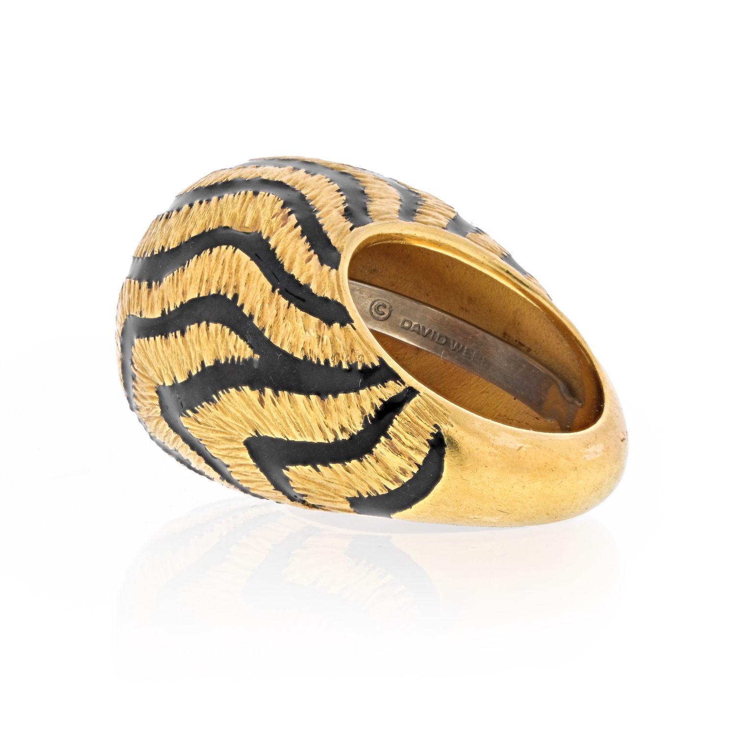 18K Yellow Gold Dome ring by David Webb decorated with black enamel wavy zebra stripes. 
Excellent condition, perfect for everyday wear. 