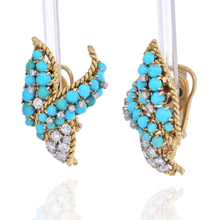 David Webb yellow gold clip earrings crafted as a leaf design set with diamonds and turquoise. 
With posts, for pierced ears. 
1 inch long. 
Can be made into clip-on earrings.