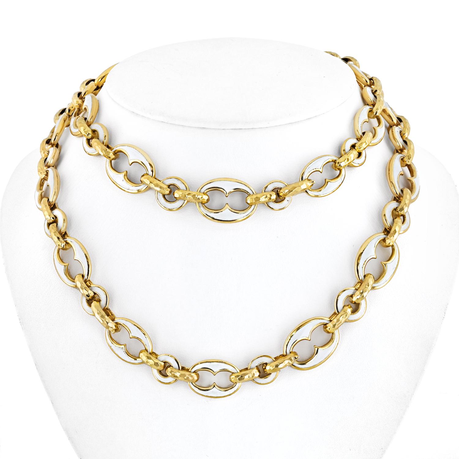 Indulge in the timeless elegance of this David Webb Gold Links Necklace, a 32-inch masterpiece that seamlessly blends sophistication with artistic flair. The gold links, adorned with white enamel, create a striking contrast and add a touch of