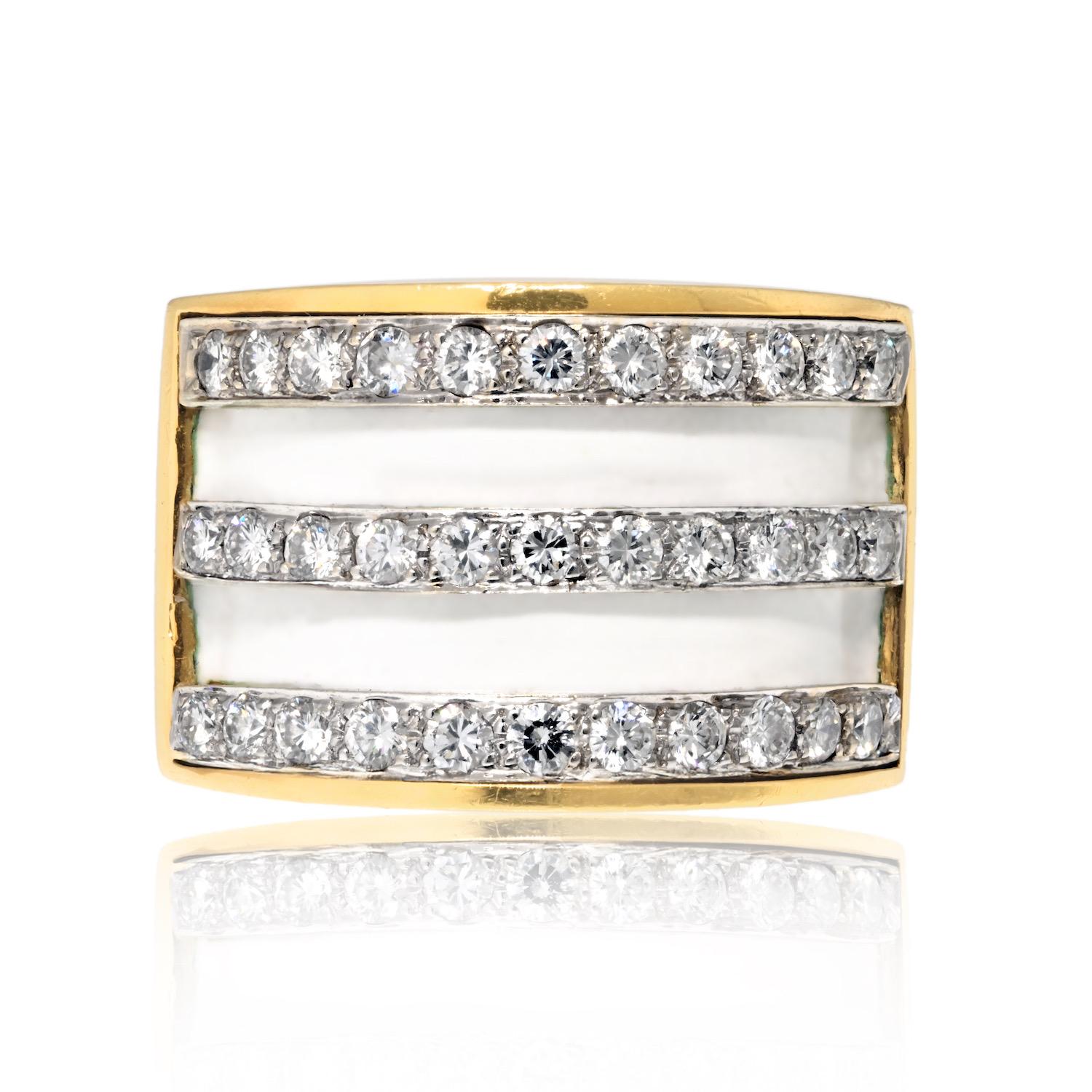 This Platinum & 18K Yellow Gold White Enamel Diamond Cocktail Ring is a striking fusion of modern design and luxurious materials. Featuring a bold geometric motif, the ring showcases three platinum rows encrusted with 3.00 carats of round-cut