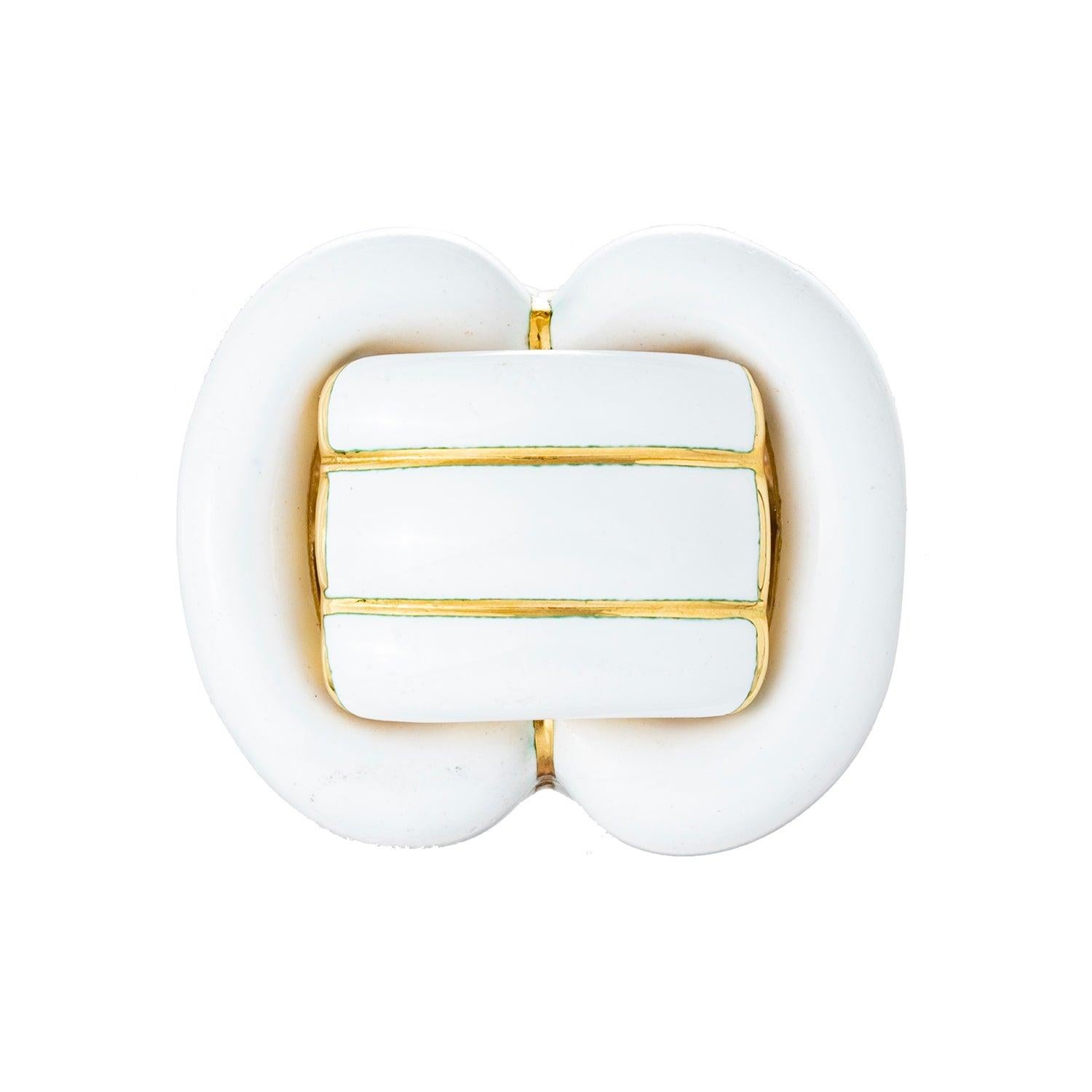 David Webb buckle motif cocktail ring, in 18k yellow gold decorated with white enamel sections.  Signed 