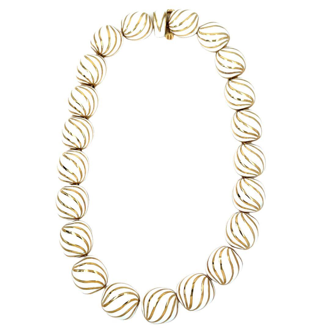 Draped gracefully around your neck, this necklace becomes a statement of your unique individuality. Elevate your style with the classic David Webb bombe necklace. The necklace feature a striking 21 bombe shape links, meticulously crafted in solid