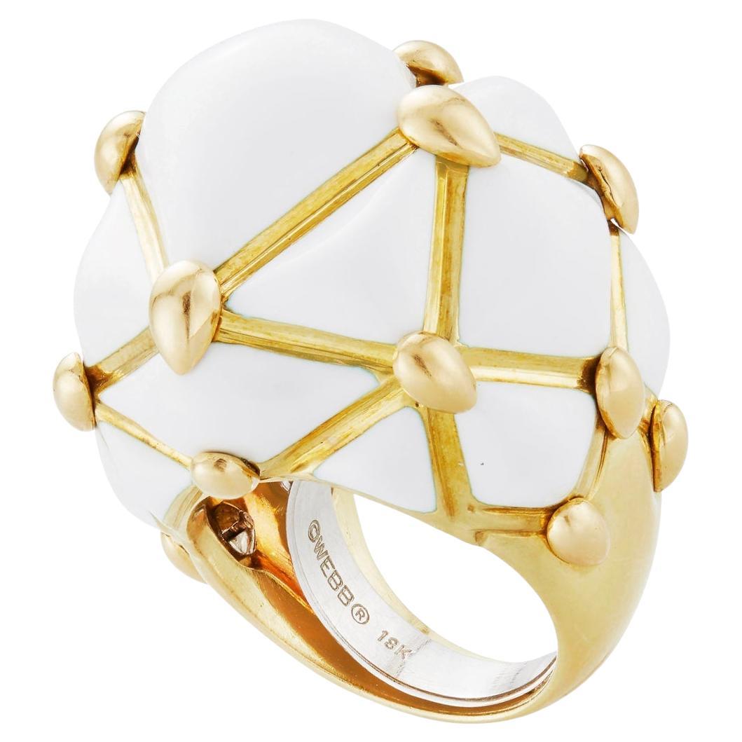 David Webb geodesic patterned domed cocktail ring in 18k yellow gold decorated with white enamel panels.  Signed '© WEBB 18k'.  Size 4.5.