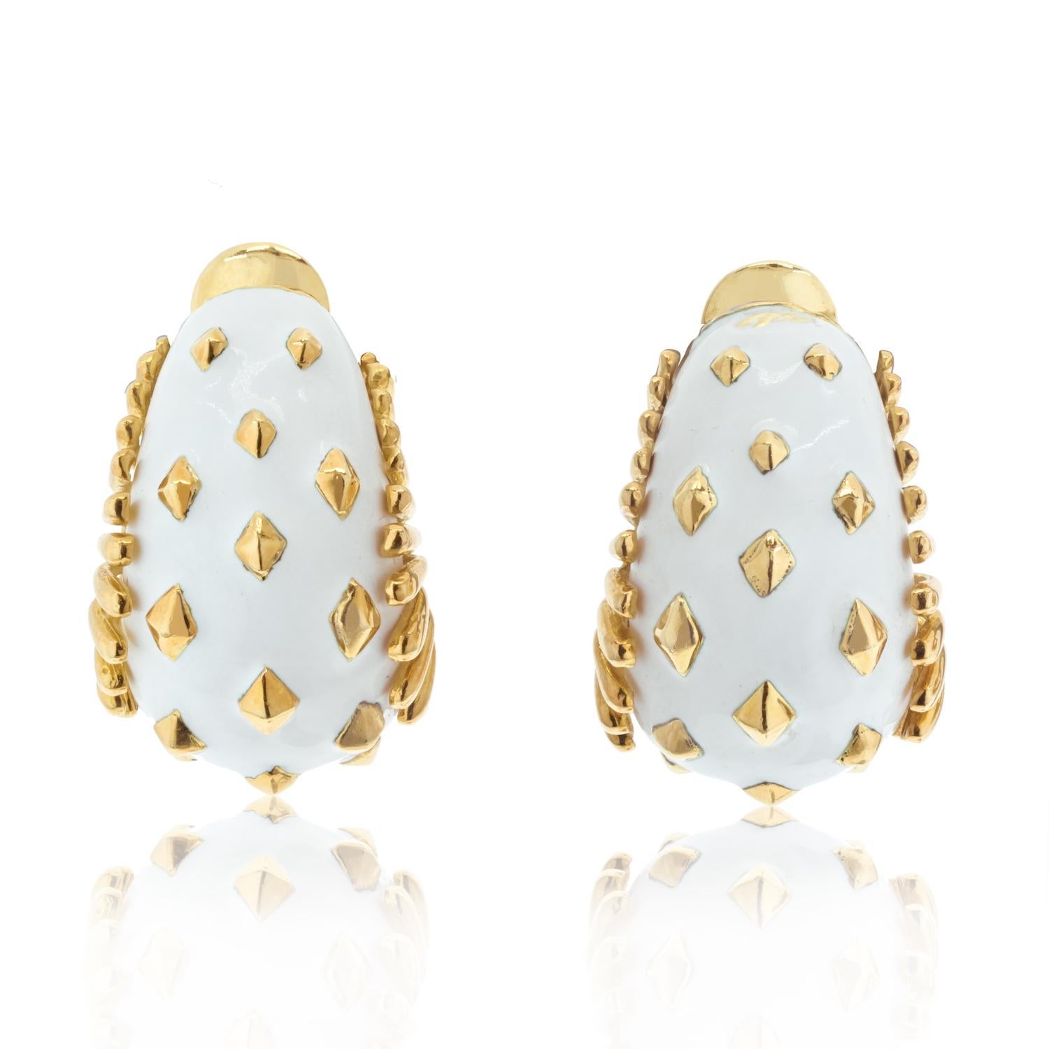 Discover the exquisite elegance of the David Webb Bombe Earrings, a timeless piece that embodies sophistication and artistry. Crafted from 18K yellow gold, these earrings feature a striking lozenge detail that adds a touch of geometric flair. The