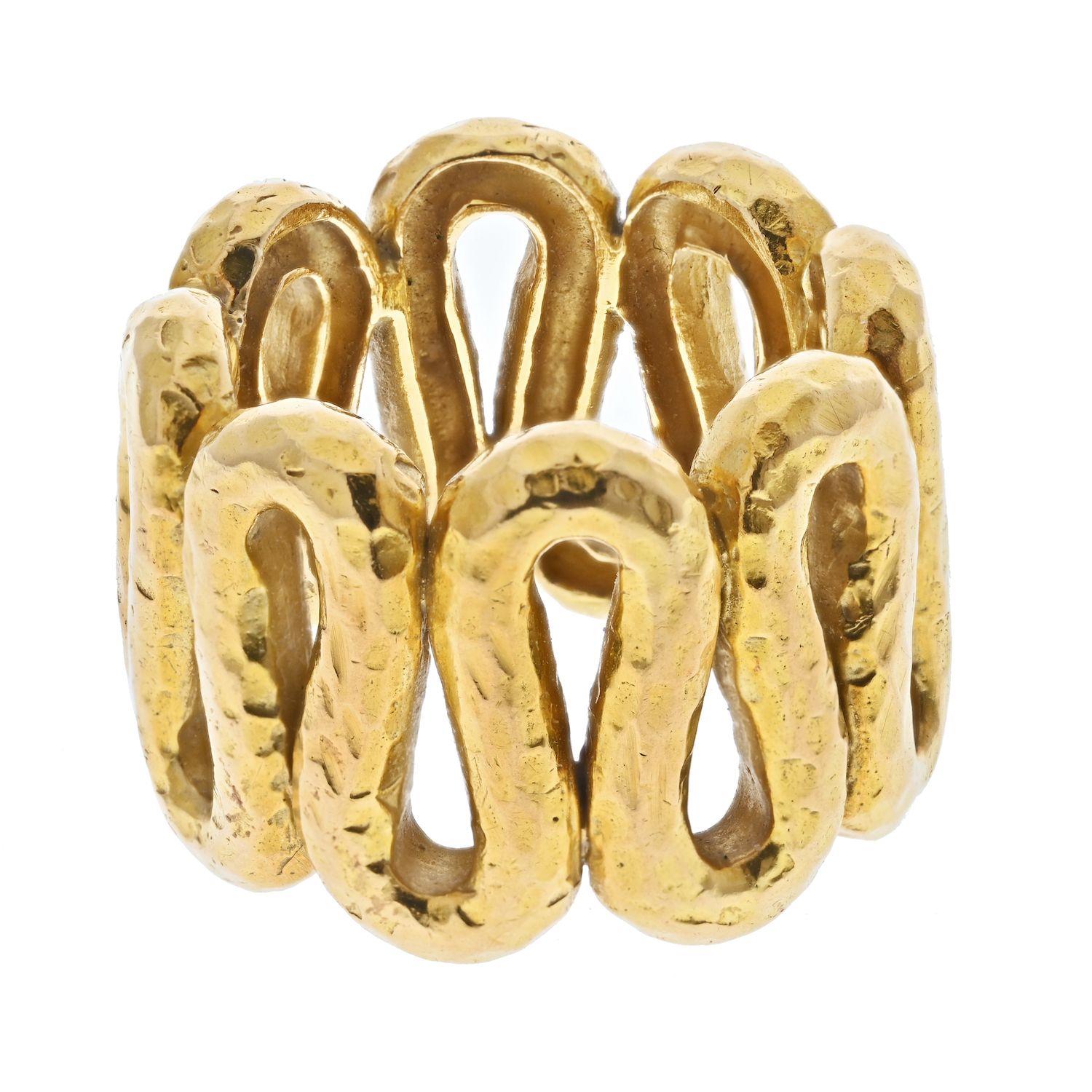 This is a cool contemporary looking ring by David Webb made in 18k yellow gold designed as a hammered wave ring. This ring has a classic Webb finish as well as quality craftsmanship.  
