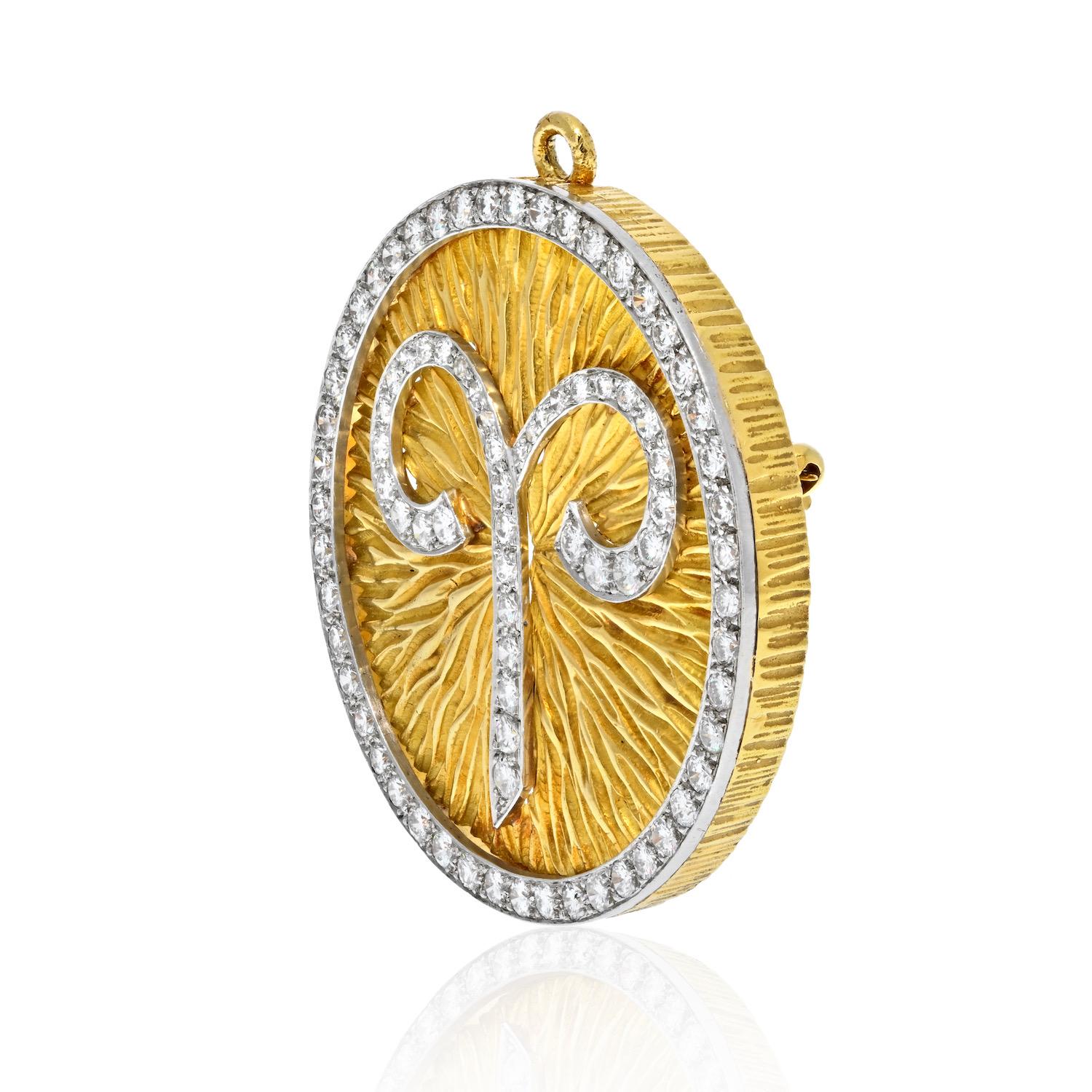 Rare David Webb 18k yellow gold and platinum large Aries zodiac pendant/brooch. These pendants are highly collectible and extremely difficult to find. 

The diamond-encrusted Aries symbol is mounted on textured gold blazon. The rim of the pendant is