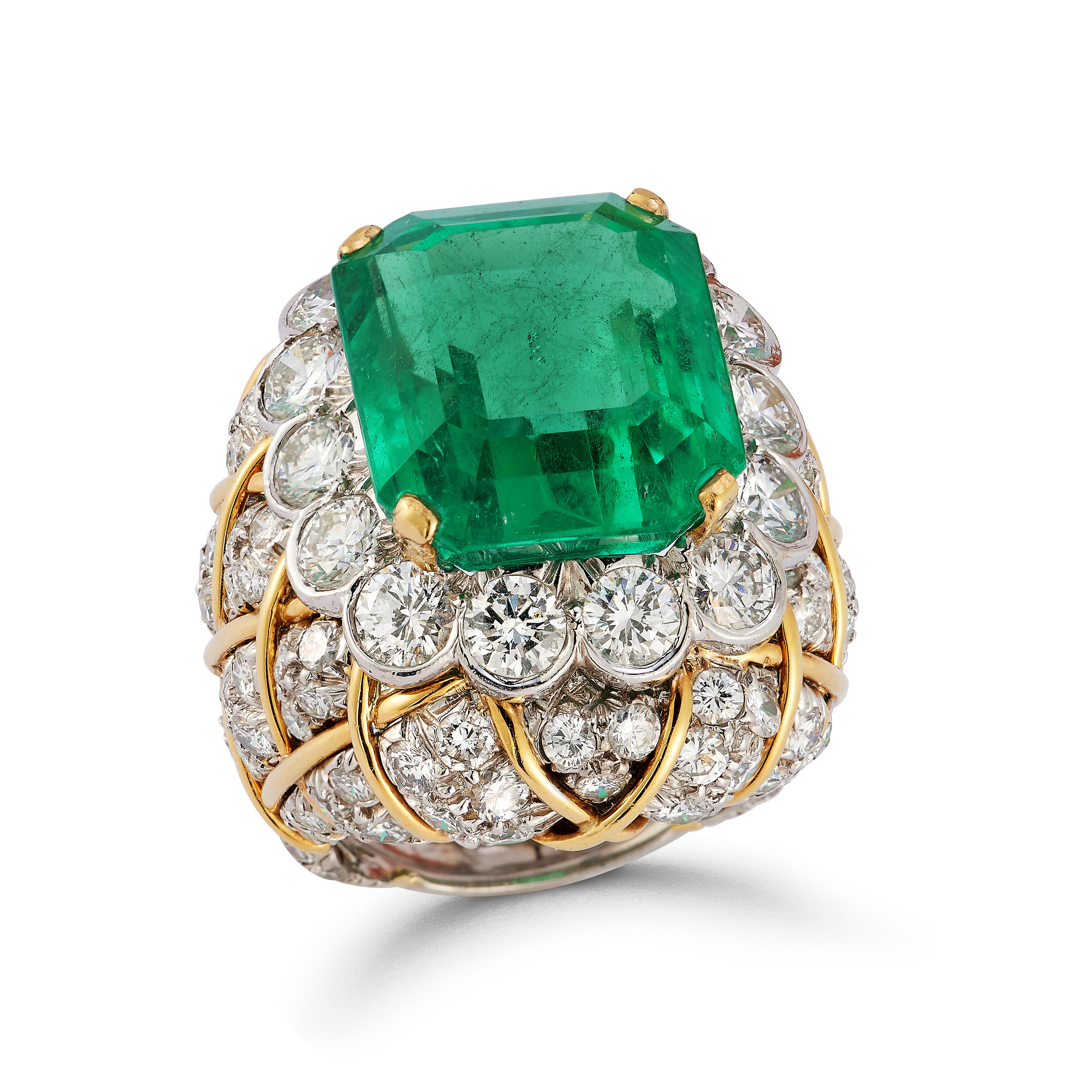 David Webb 19 Carat Colombian Emerald & Diamond Ring

A platinum and 18 karat gold ring featuring a GIA certified octagonal cut Colombian emerald surrounded by round cut diamonds.

Accompanied with certificate of authenticity and a GIA report on the