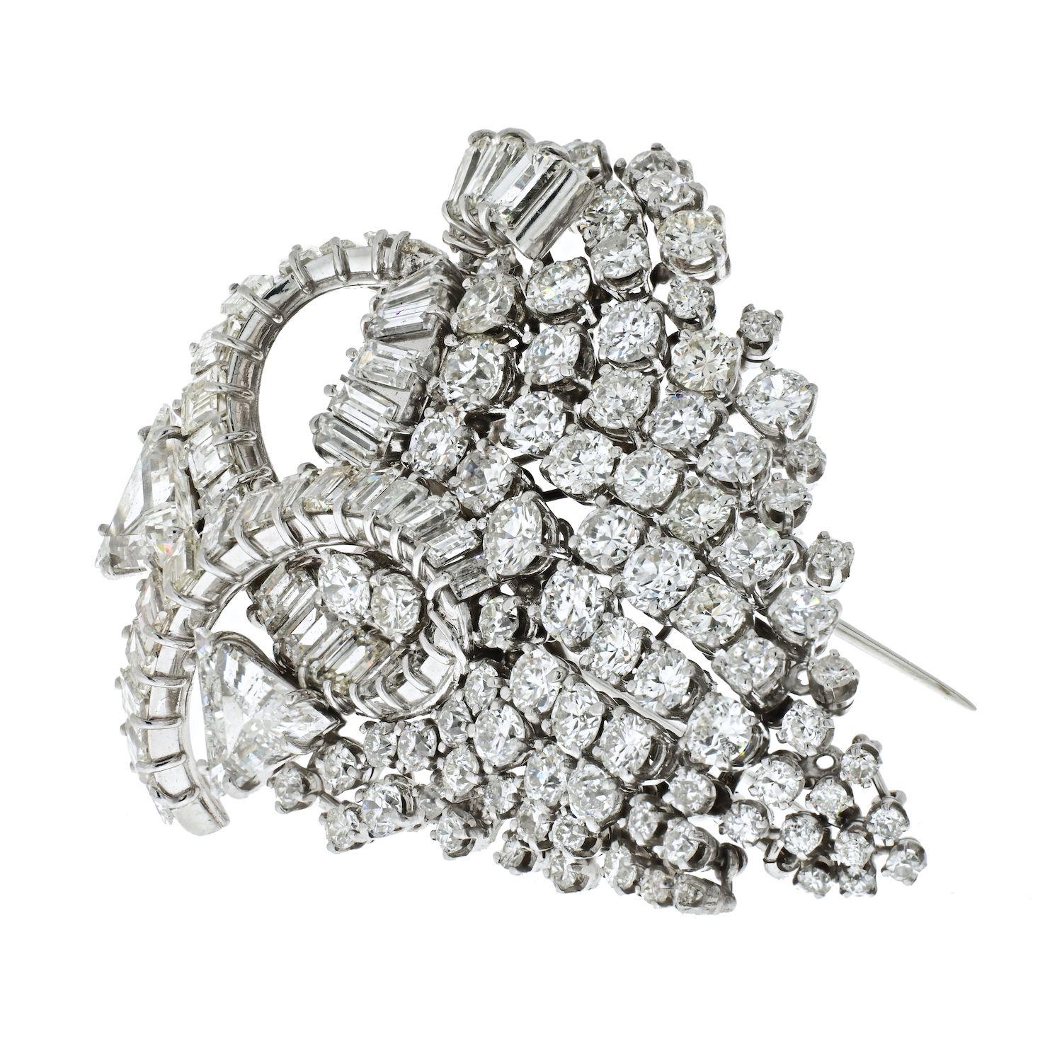 This is an impressive David Webb cluster diamond brooch crafted in 1960's set in platinum.
All diamonds are of an exceptionally white quality and grade between F to G color and VS1-VS2 clarity. 
Double pin fastening. 
Brooch measures about 2 inches
