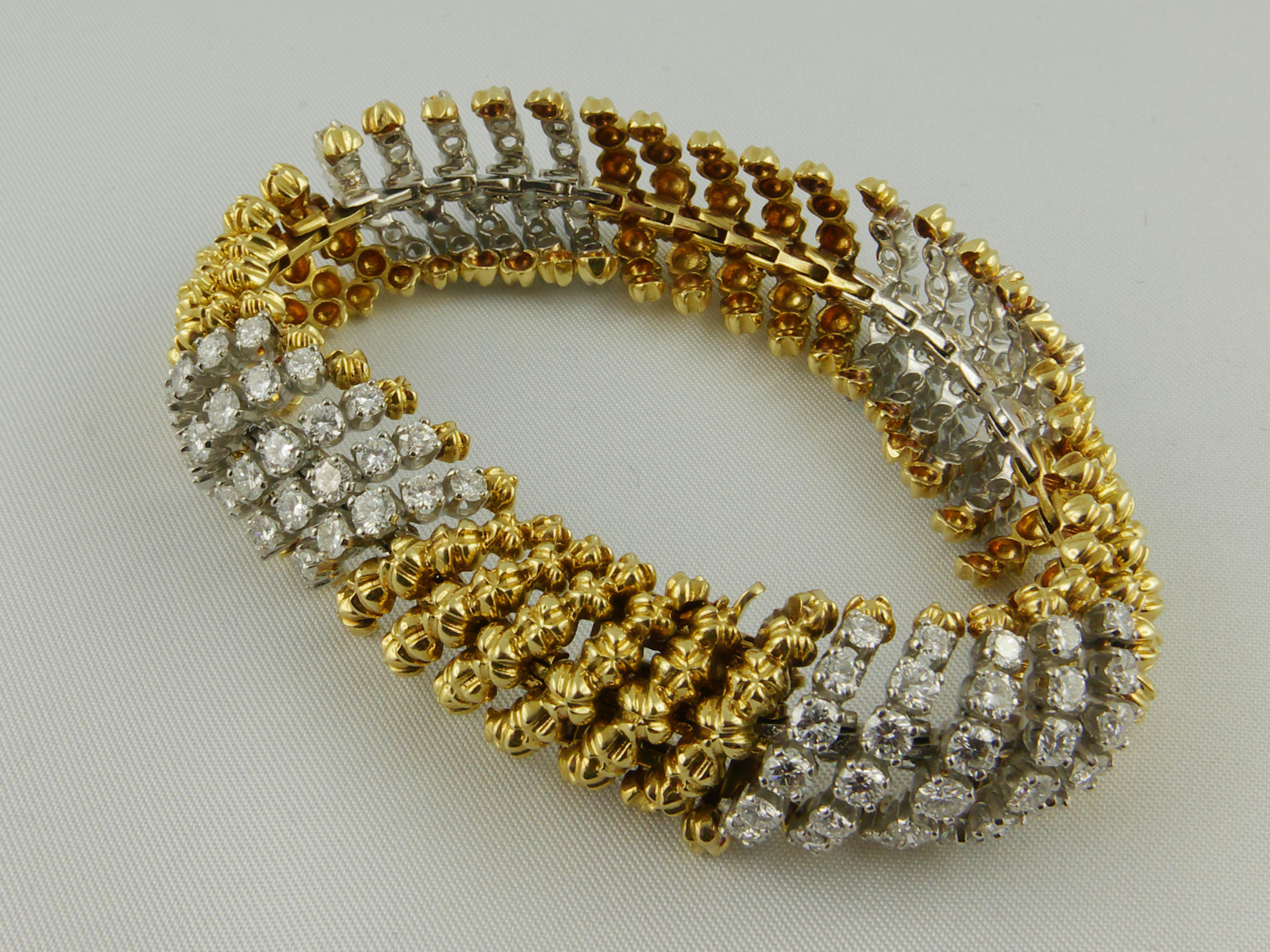 David Webb 1960’s  bombé flexible Band of Yellow Gold textured finish boules and Platinum set Diamonds.  Classy and feminine Bracelet  made of 18 karat Yellow Gold alternating and accented   with four inserts made of five  diagonal rows of