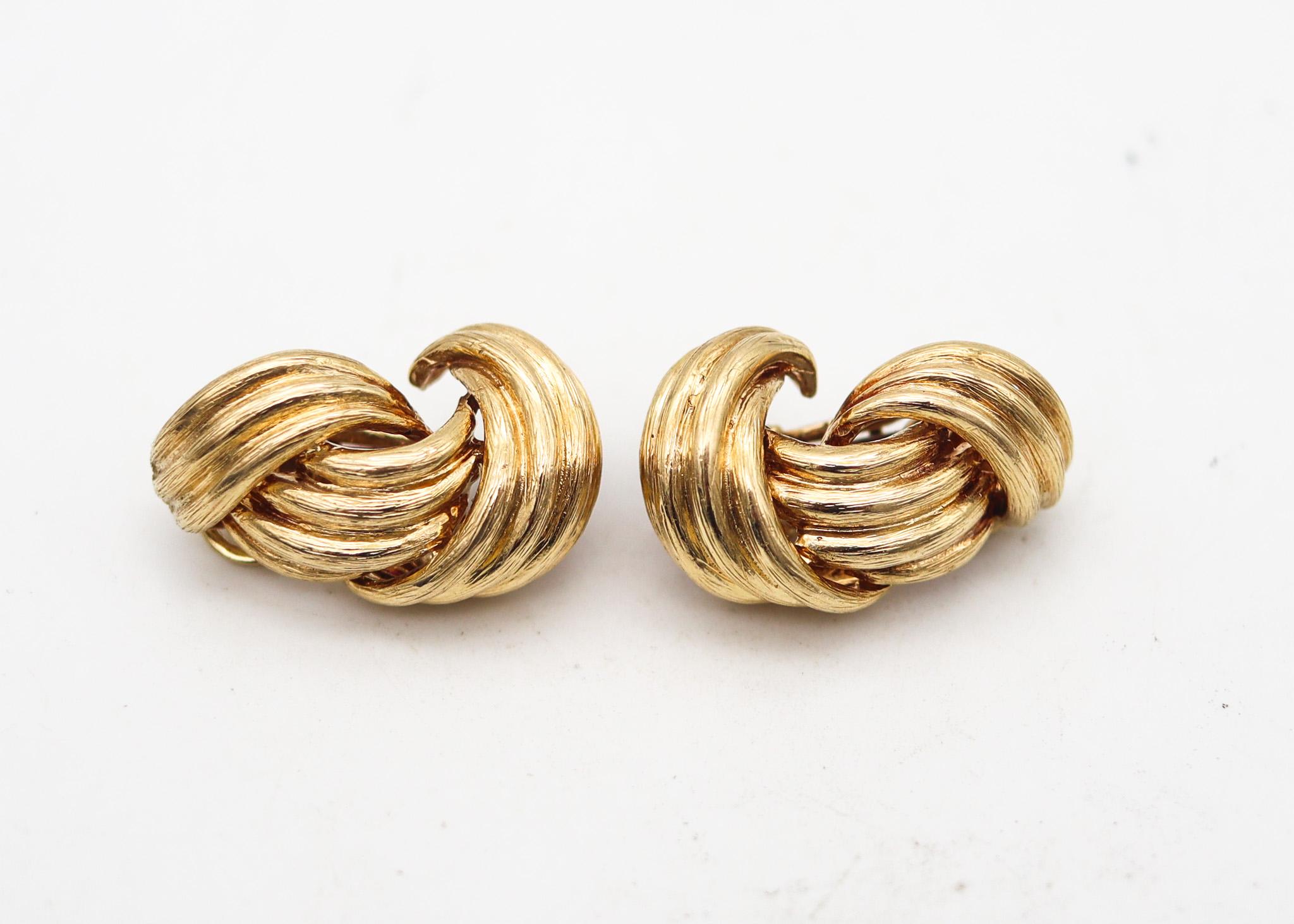 Pair of clips-on earrings designed by David Webb (1925-1975).

A vintage pair of clips-on earrings, created in New York city at the jewelry atelier of David Webb, back in the 1970's. These pair of earrings were designed as left and right pairs and