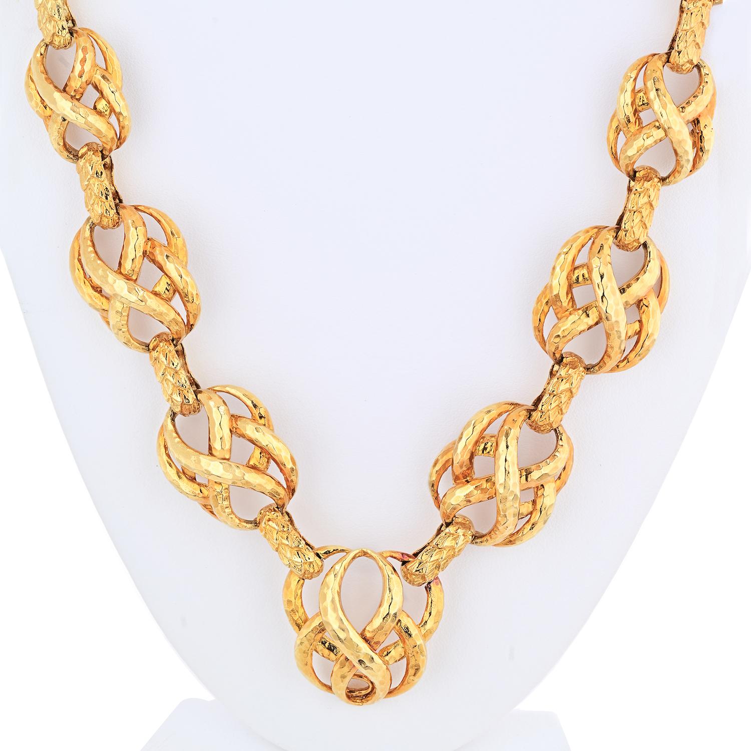 Bold and heavy yellow gold necklace created by David Webb in the 1980's. The intricate link shape with an infinity sign in the middle was inspired by ancient Celtic motifs and is finished with a signature hammer and wheat design. 
L: 30 inches