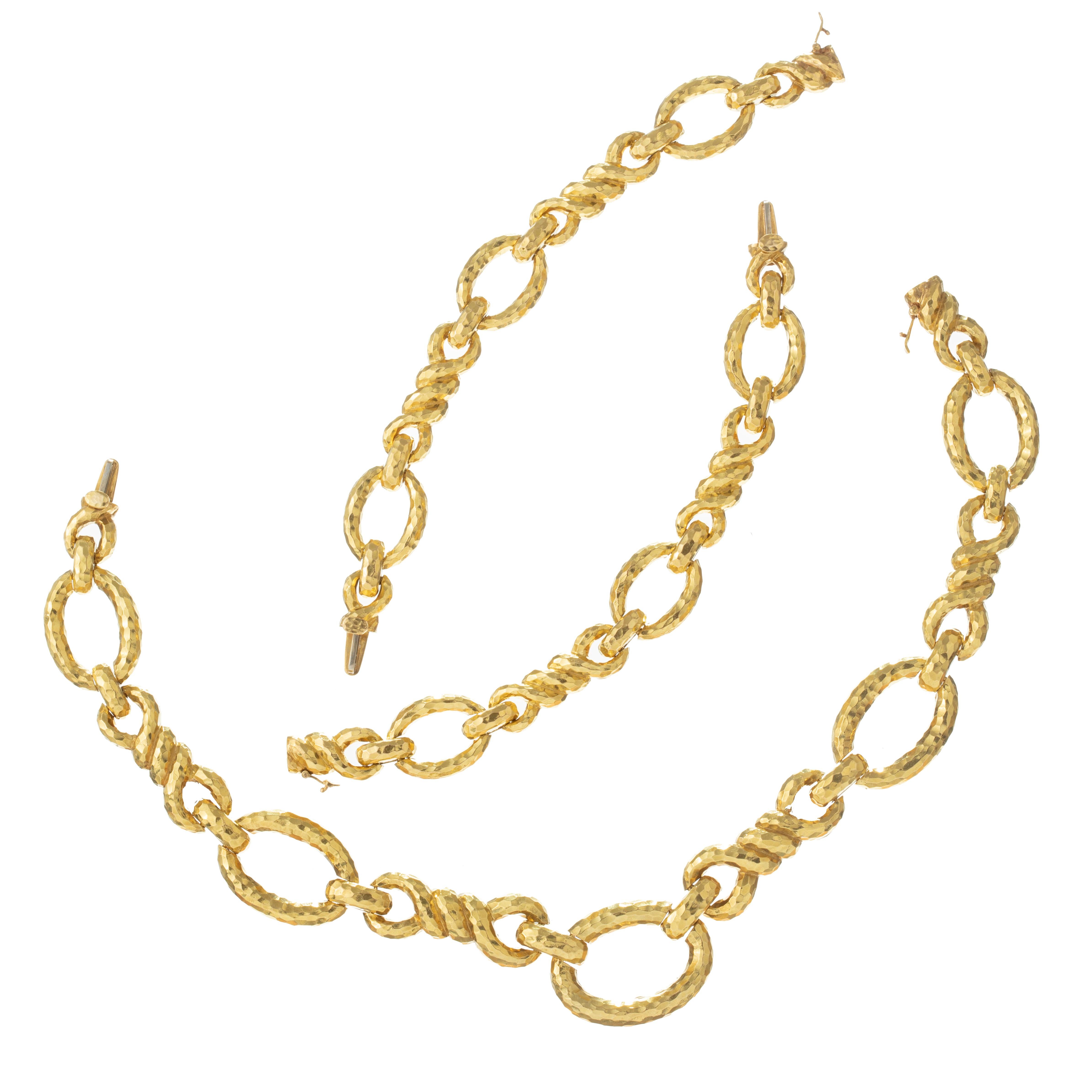 David Webb 1970s long link necklace in hammered 18k yellow gold.  Necklace converts into a collar necklace with two matching link bracelets.  Necklace measuring 30