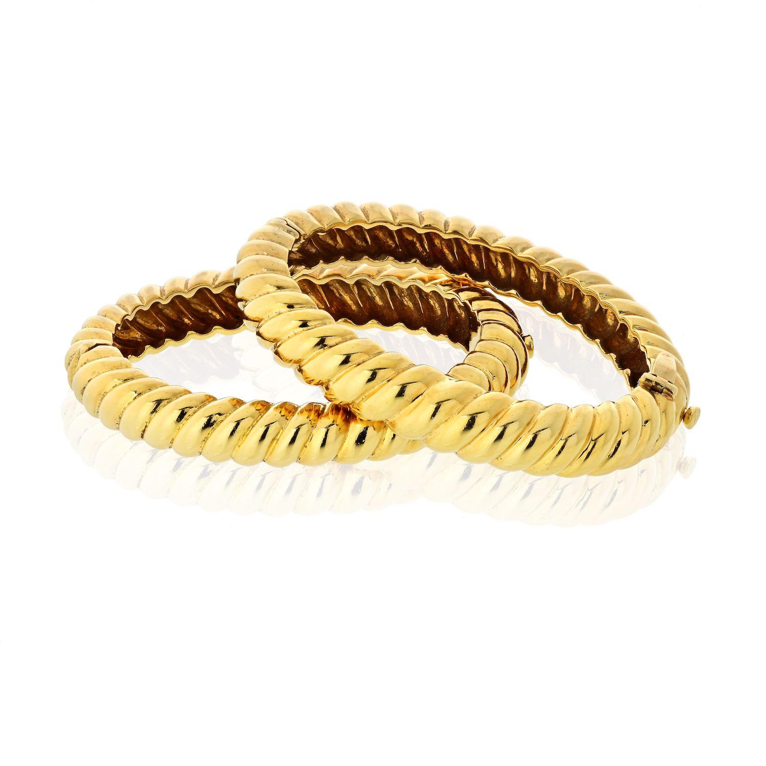 David Webb yellow gold matching bangle bracelets with hinged closures. Small size, best for wrist 5.5 inches to 5.75 inches. 
Priced for both. 
Hinged closure. 