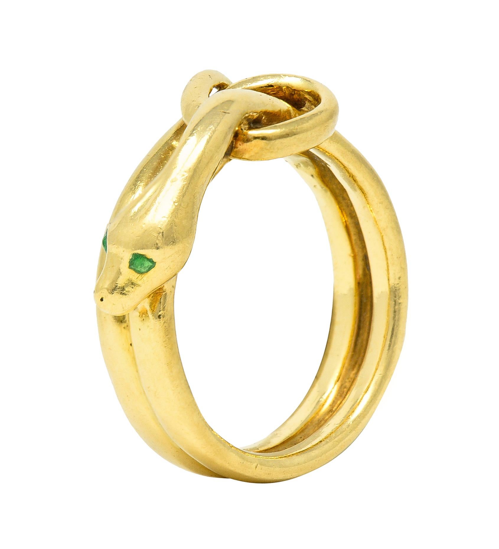 Designed as a coiled snake and terminating with a looped tail and head
Stylized with sleek minimalist features and accented by demantoid garnet eyes
Flush set and transparent bright green in color
Tested with partial stamp for 18-karat gold
Fully