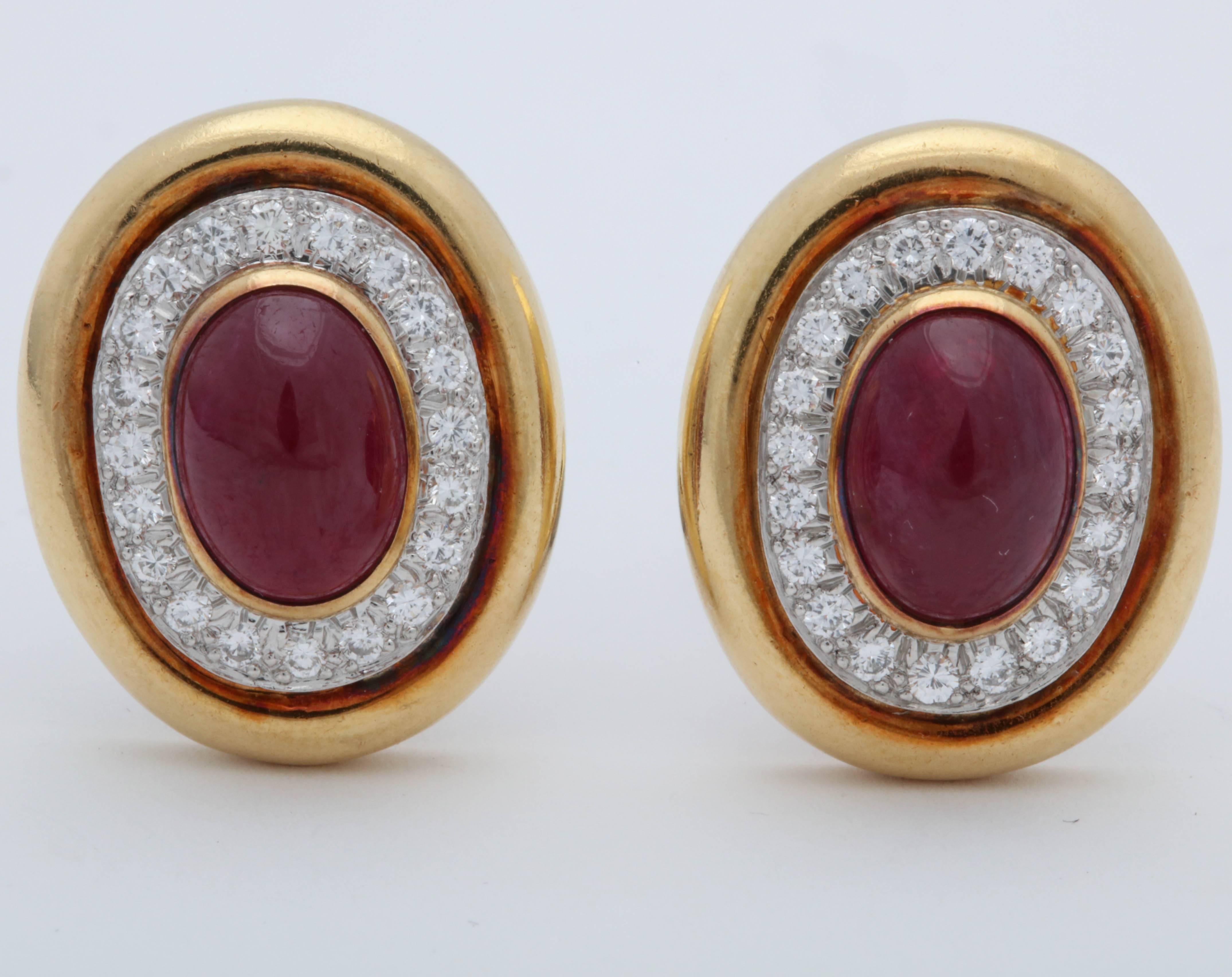 One Pair Of Ladies 18kt Yellow Gold Clip Back Earrings Centering A 20MM Each Cabochon Ruby Weighing approximately Three Carats . Rubies Are Surrounde By Numerous High Quality Full cut diamonds Weighing Approximately Two Carats Total weight.NOTE: All