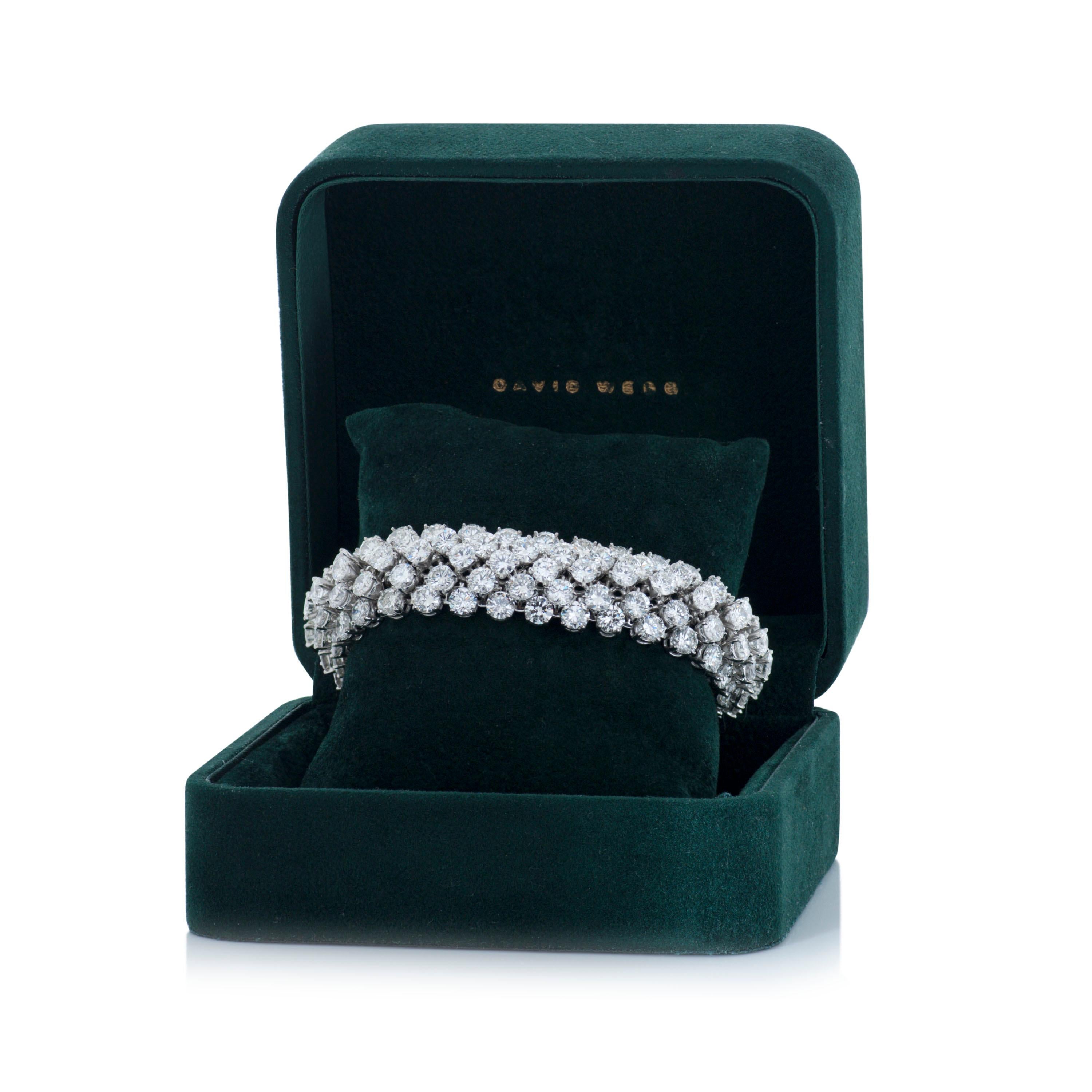 David Webb flexible platinum 5 row diamond bracelet accompanied by a David Webb box and David Webb certificate of authenticity.

This David Webb bracelet features five rows of round brilliant cut diamonds totaling approximately 52.00 carats set in