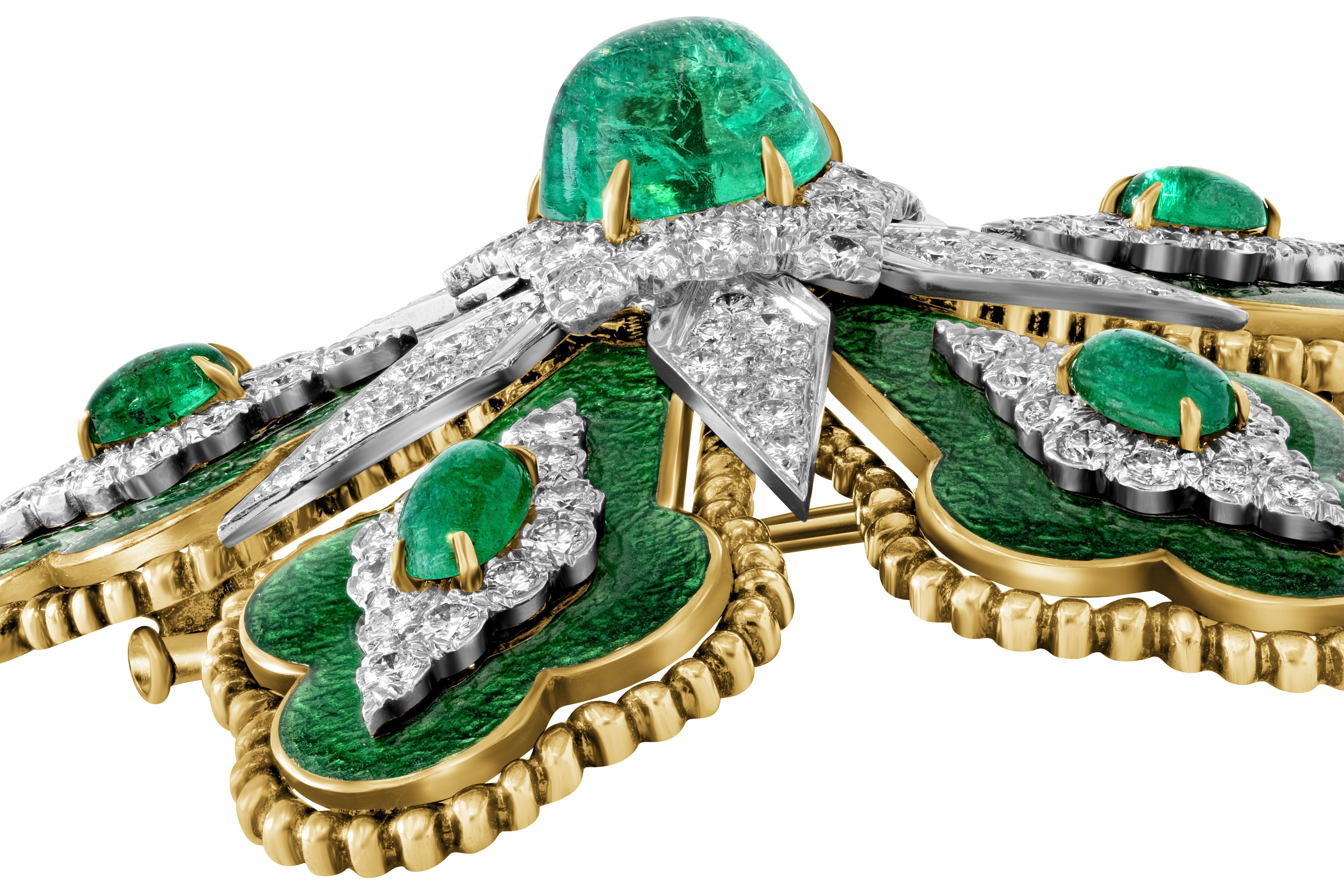 Exceedingly rare estate David Webb signed floral brooch featuring a 5.85ct center emerald cabochon, approximately 3cts of emeralds, approximately 3cttw of pavé set diamonds and marbleized emerald green guilloché enamel set in platinum and 18k yellow
