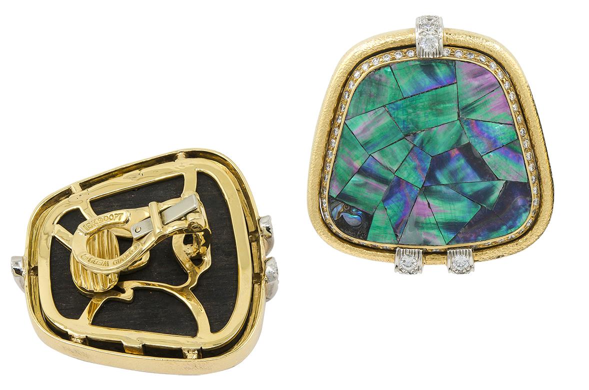 DAVID WEBB Abalone Shells, Diamond Earrings

An 18k yellow gold and platinum ear clips, set with diamonds and abalone shells.
Measures approx. 1.45″ in length by 1.56″ in width
Stamped “DAVID WEBB”; circa 2000s.