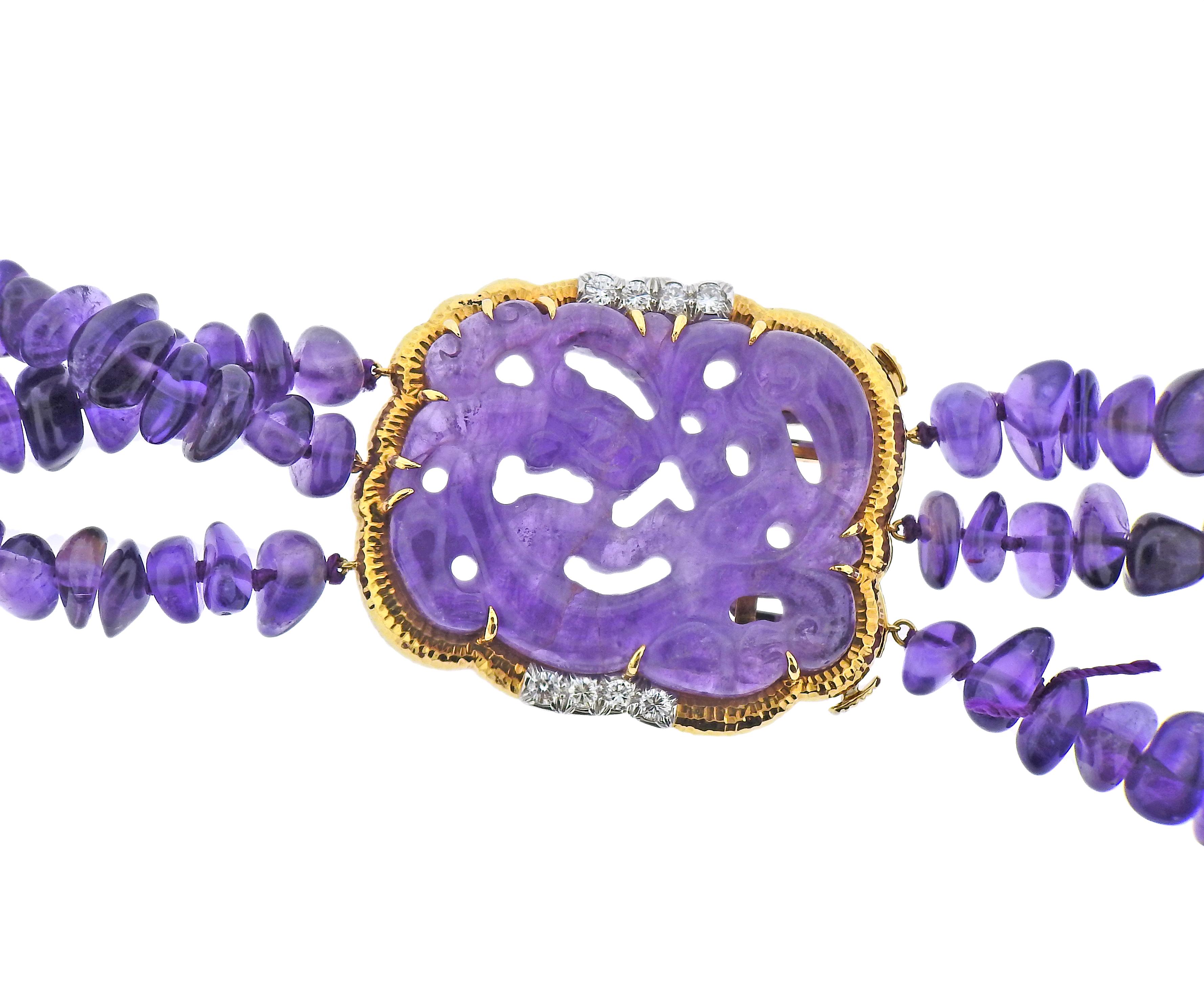 David Webb amethyst bead necklace, featuring carved amethyst clasp, set in 18k gold and platinum, with approx. 0.80ctw in diamonds. Necklace is 25.5