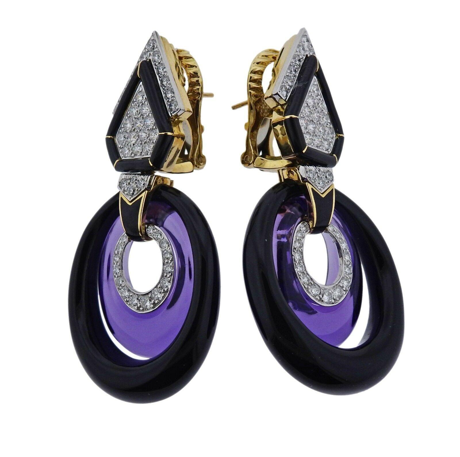 Exquisite pair of 18k gold and platinum earrings crafted by David Webb. Earrings feature amethyst and onyx, are set with approximately 1.80ctw of G/VS diamonds. Earrings measure 58mm long X 26mm at widest point, weight is 30.4 grams. Marked David