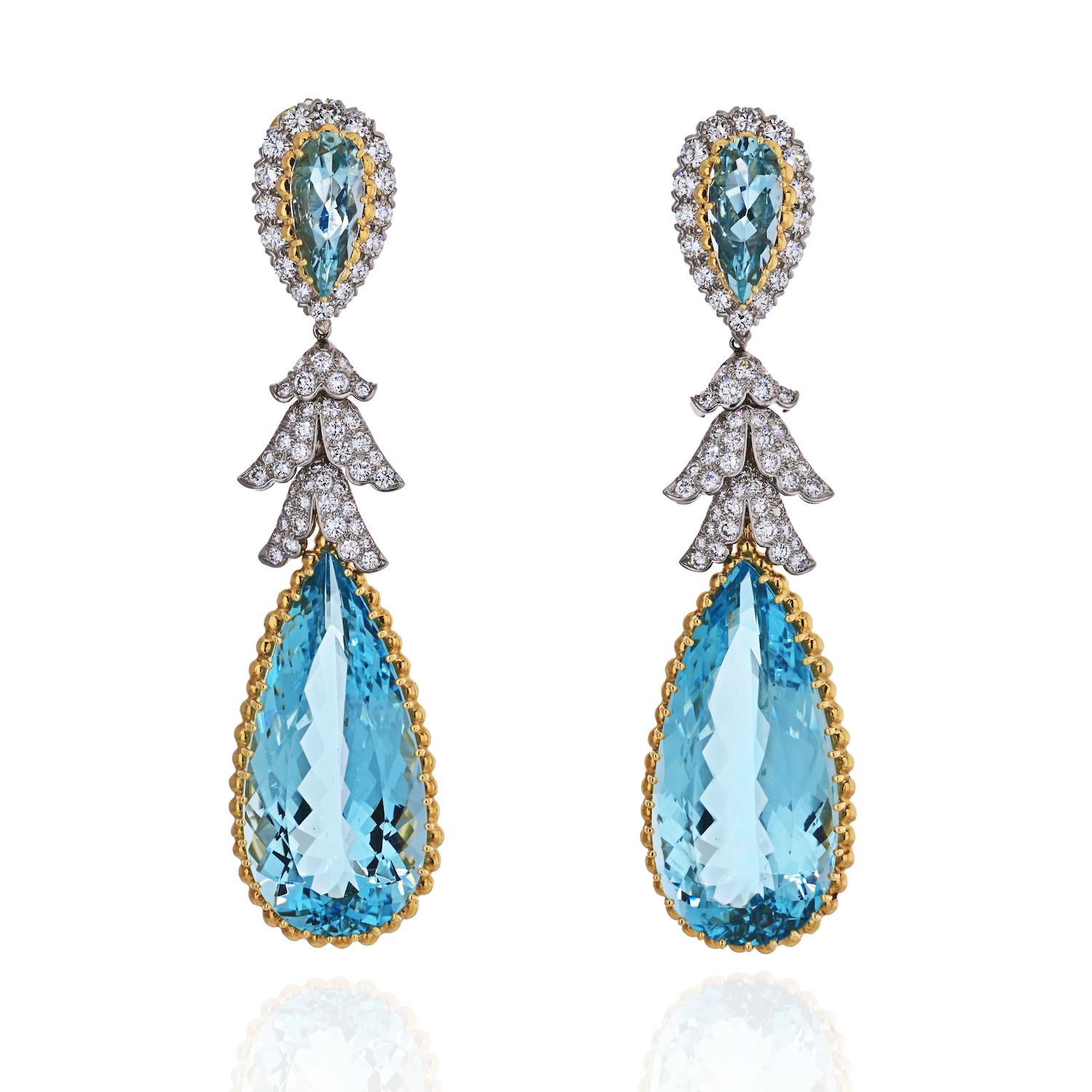 Indulge in the epitome of luxury with our extraordinary David Webb Teardrop Aquamarine and Diamond Dangling Earrings. These stunning statement pieces are meticulously crafted in a harmonious blend of 18K Yellow Gold and Platinum, presenting a