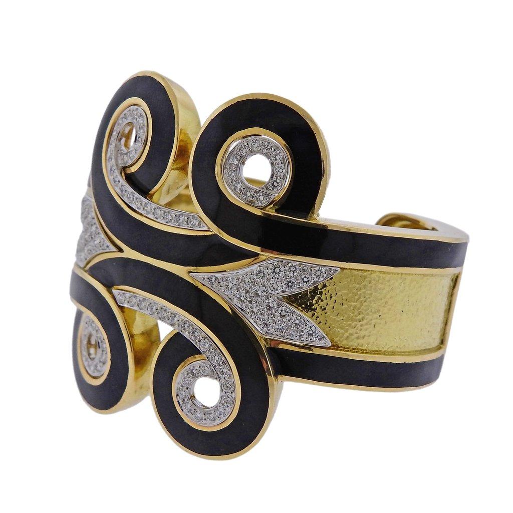18k gold and platinum Arabesque cuff bracelet, designed by David Webb, adorned with black enamel and approx. 2.25ctw in H/VS diamonds. Retail $68000. Bracelet will fit approx. 7