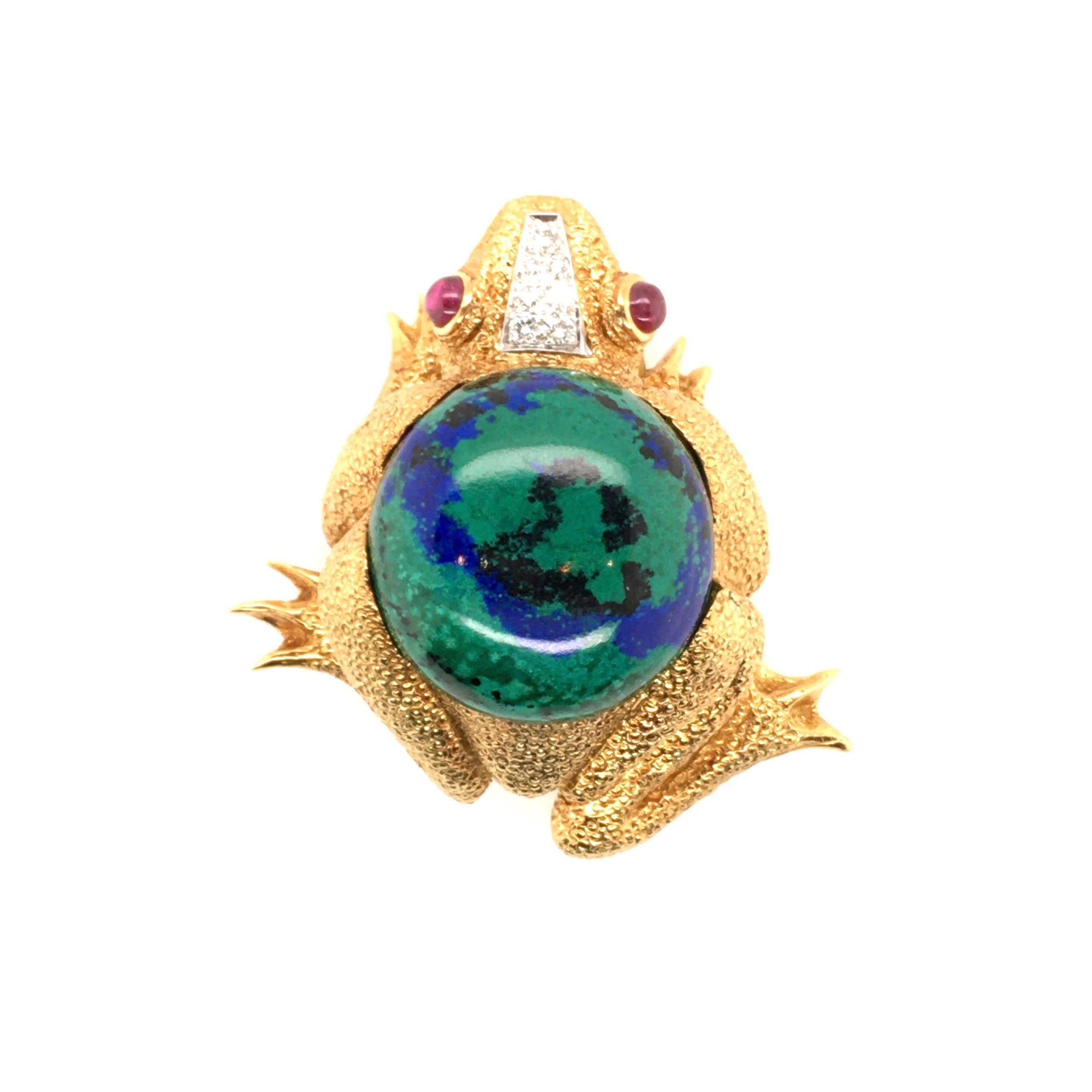 An 18 karat yellow gold, azurmalachite, ruby and diamond frog brooch. David Webb. Designed as a textured gold seated frog, set to the top with a cabochon azurmalachite, measuring approximately 26mm, enhanced by cabochon ruby eyes and a pave set