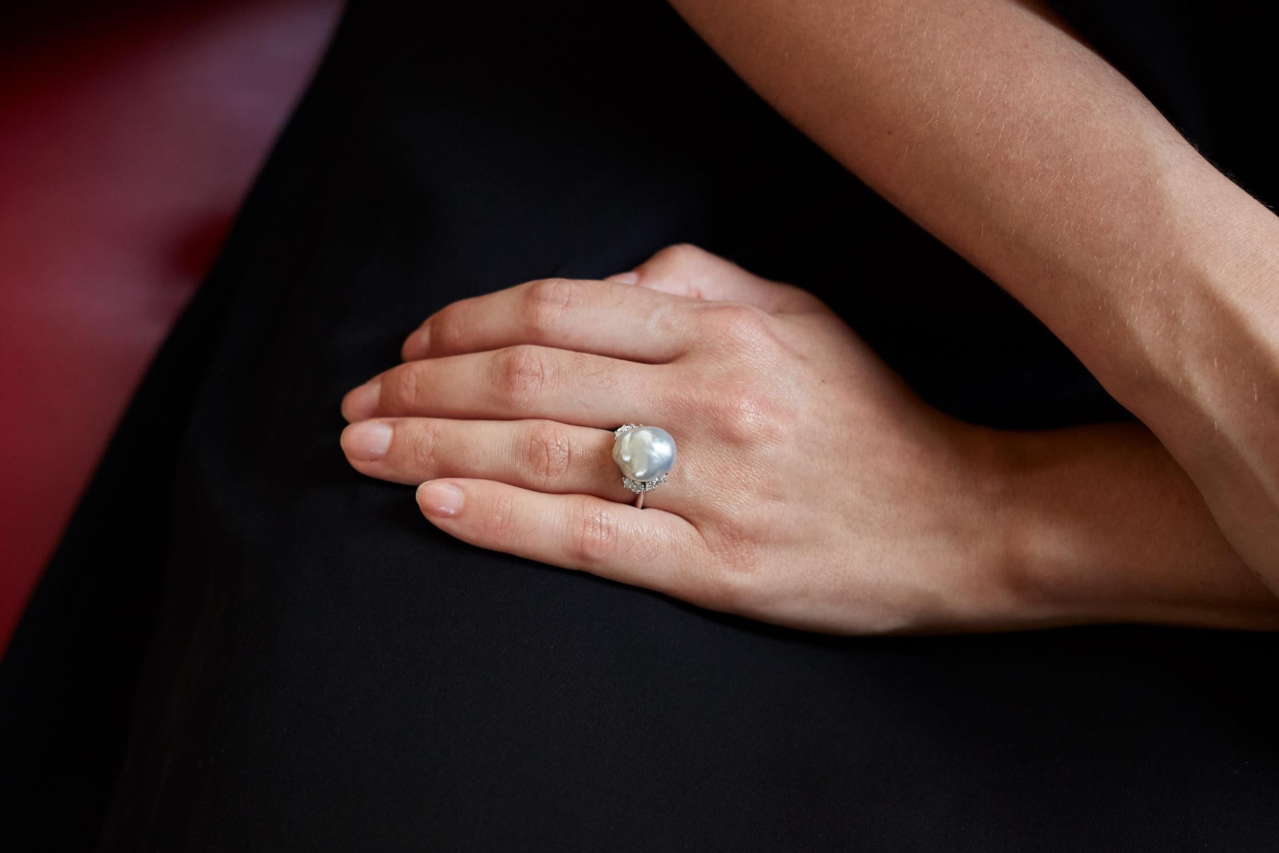 Pure and simple David Webb. A baroque pearl, diamond and platinum ring, by David Webb. The ring measures a size 06¼ and weighs 9.4 grams. It is stamped Webb, 900 and PLAT. The ring has 4 marquise shaped diamonds with approximate total weight of 0.50