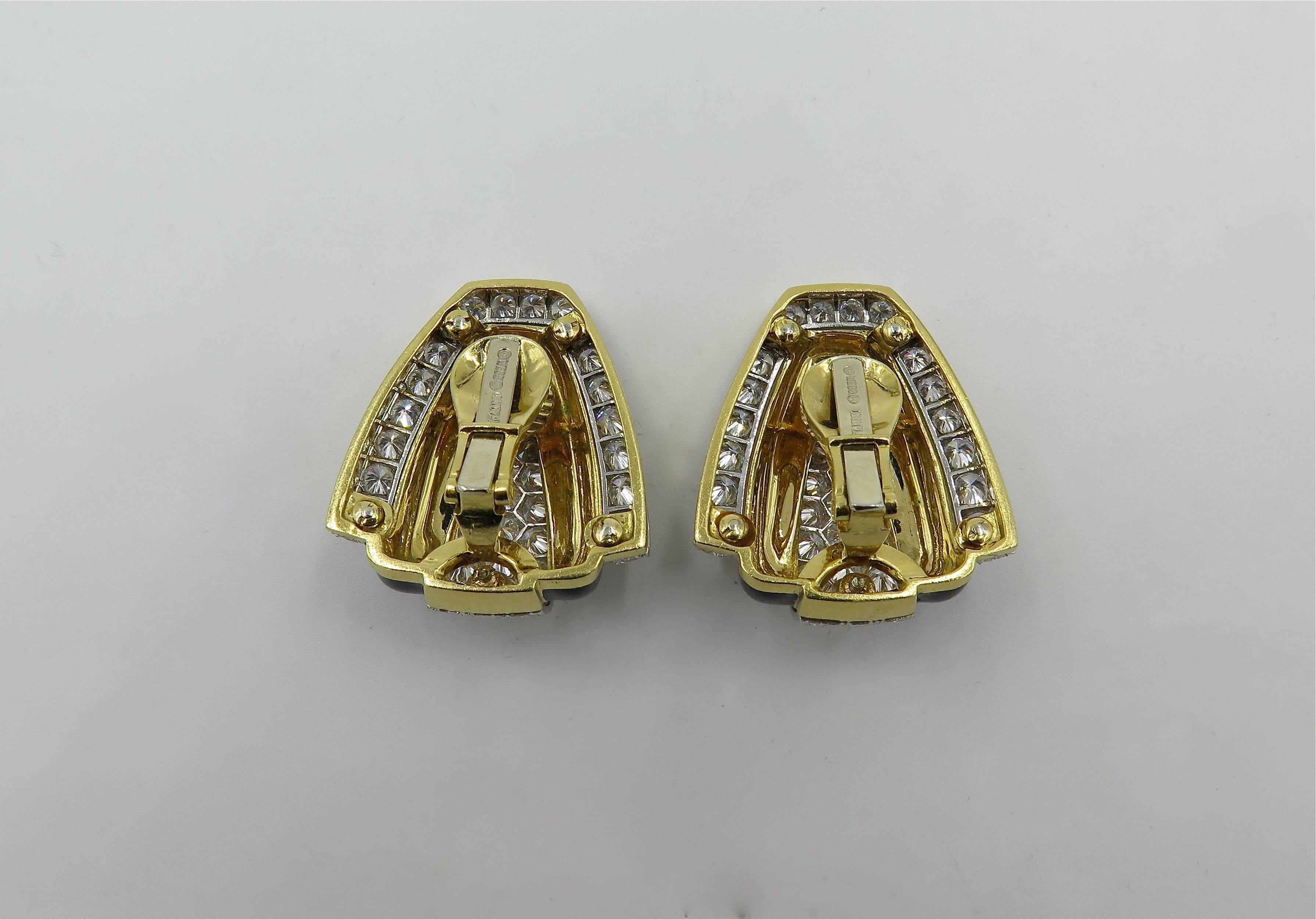 A pair of 18 karat yellow gold, black enamel and platinum set diamond earrings.  David Webb.