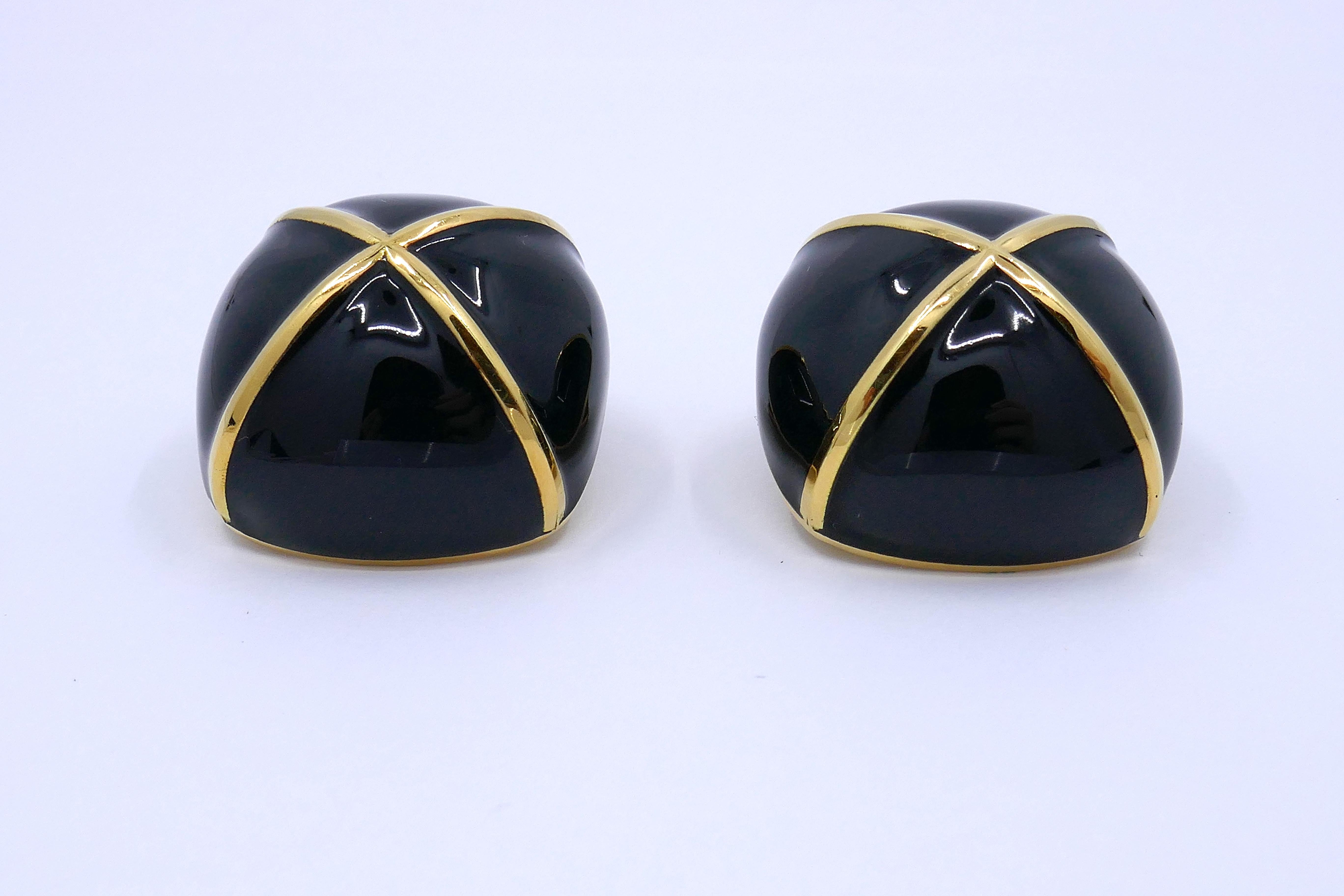 Discover the epitome of elegance with these exquisite David Webb 18K Yellow Gold Black Enamel Large Square Cushion Shape Clip-On Earrings. These magnificent ear clips are a true work of art, crafted to perfection by the renowned brand, David