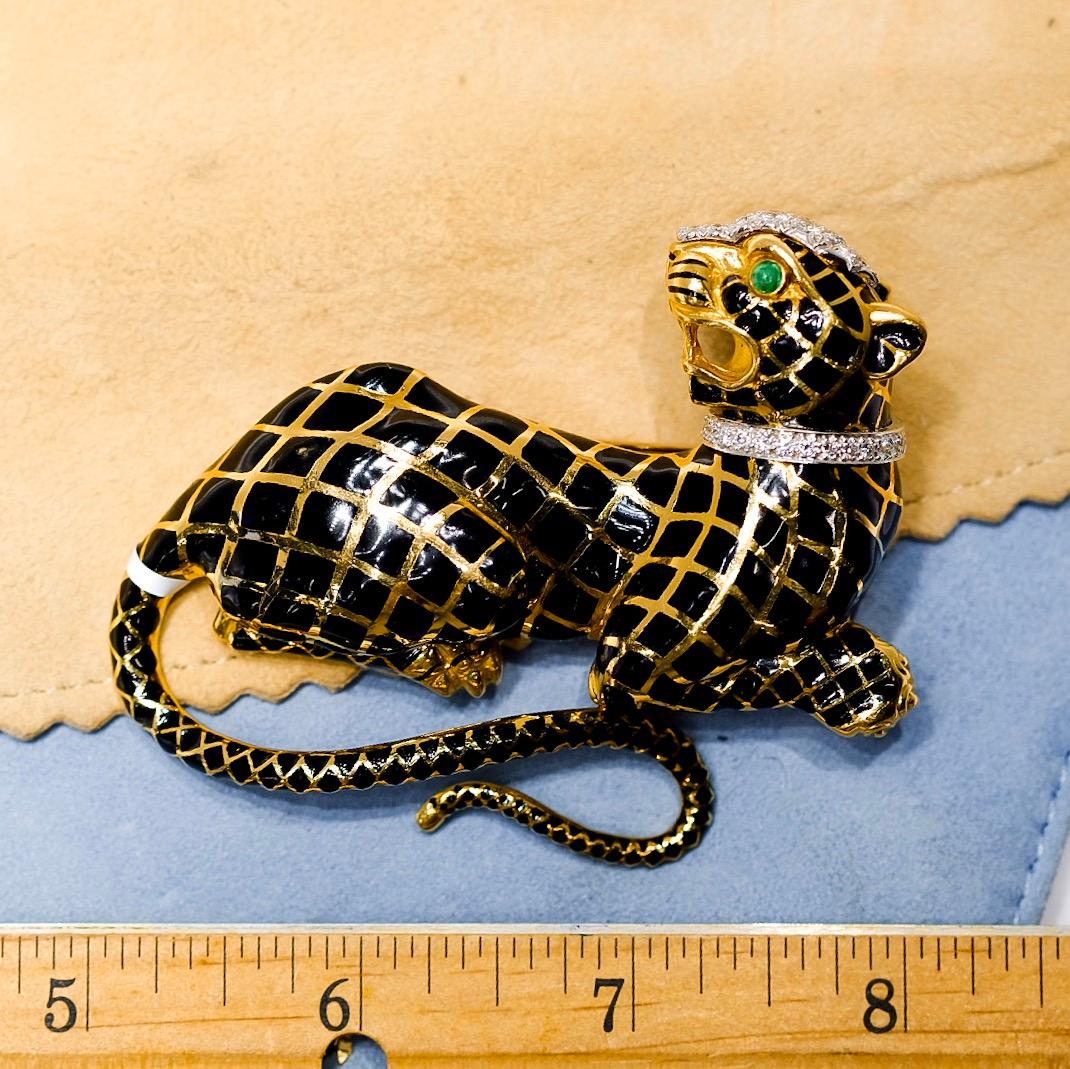 David Webb Black Enamel Panthere With A Diamond Collar 18K Yellow Gold 1970's Brooch.
Designed as a sculpted black enamel and gold panther, to the pavé-set diamond collar and emerald-set eye, mounted in 18K yellow gold and platinum, length 7.5