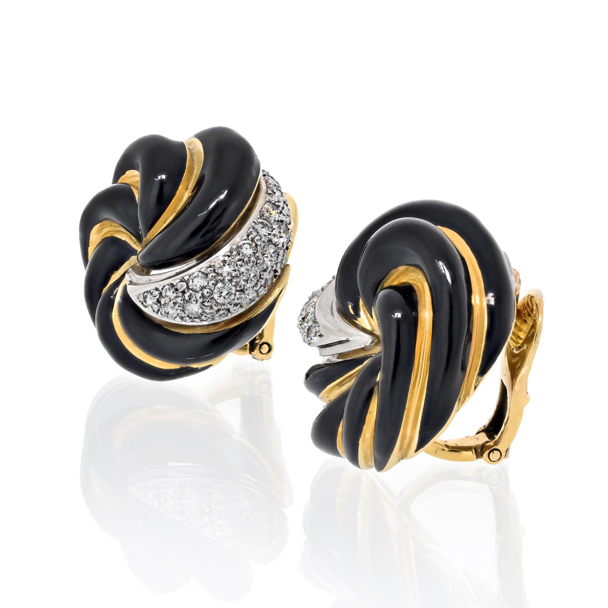 David Webb black enamel and diamond ear -clips in 18k yellow gold and platinum. The earrings feature bombe swirl design alternating gold and black enamel. Each earring accented with one platinum plate encrusted with 54 round brilliant cut diamonds
