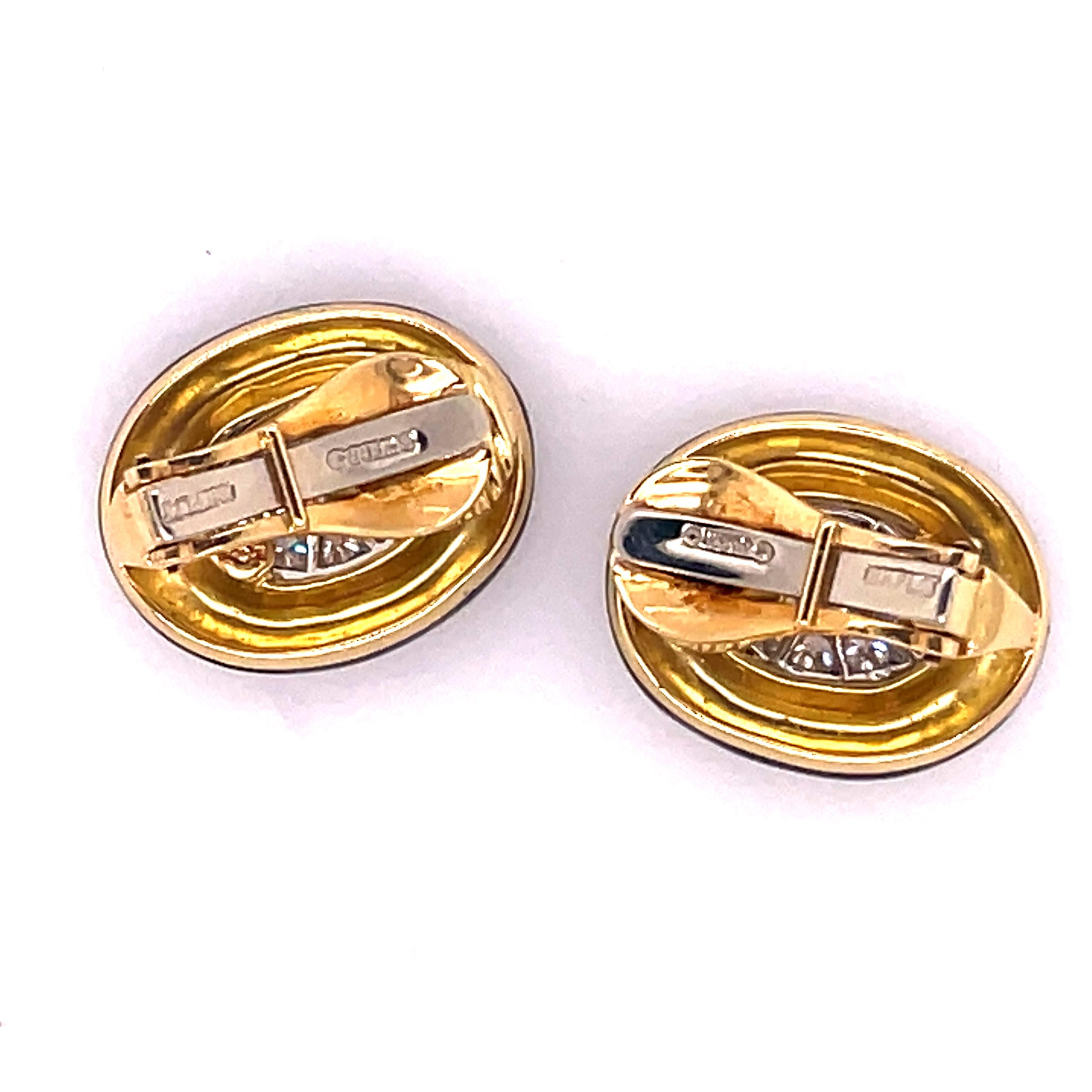 Classic David Webb Earrings with beautiful enameling and diamonds throughout the center.
18kt gold
with omega backs
