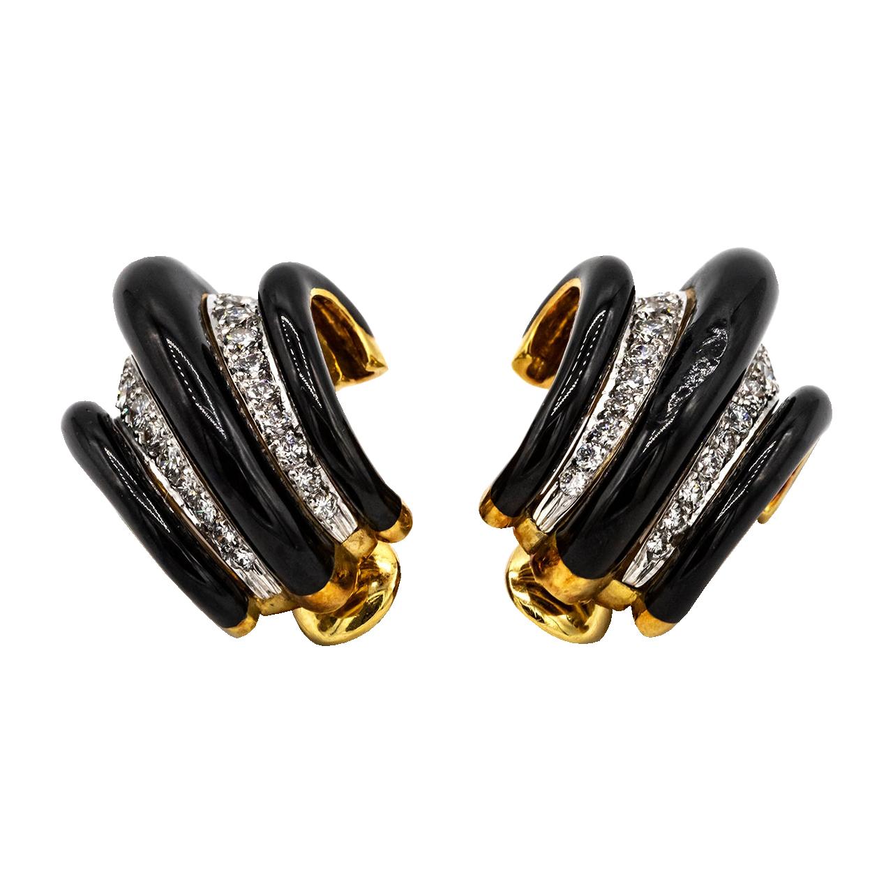 Get a great look with this vintage David Webb enamel and diamond ear clips. Shrimp style earrings will become your favorite to wear out or to the office. Each designed with alternating diamond-set platinum panels and black enamel.

Length: