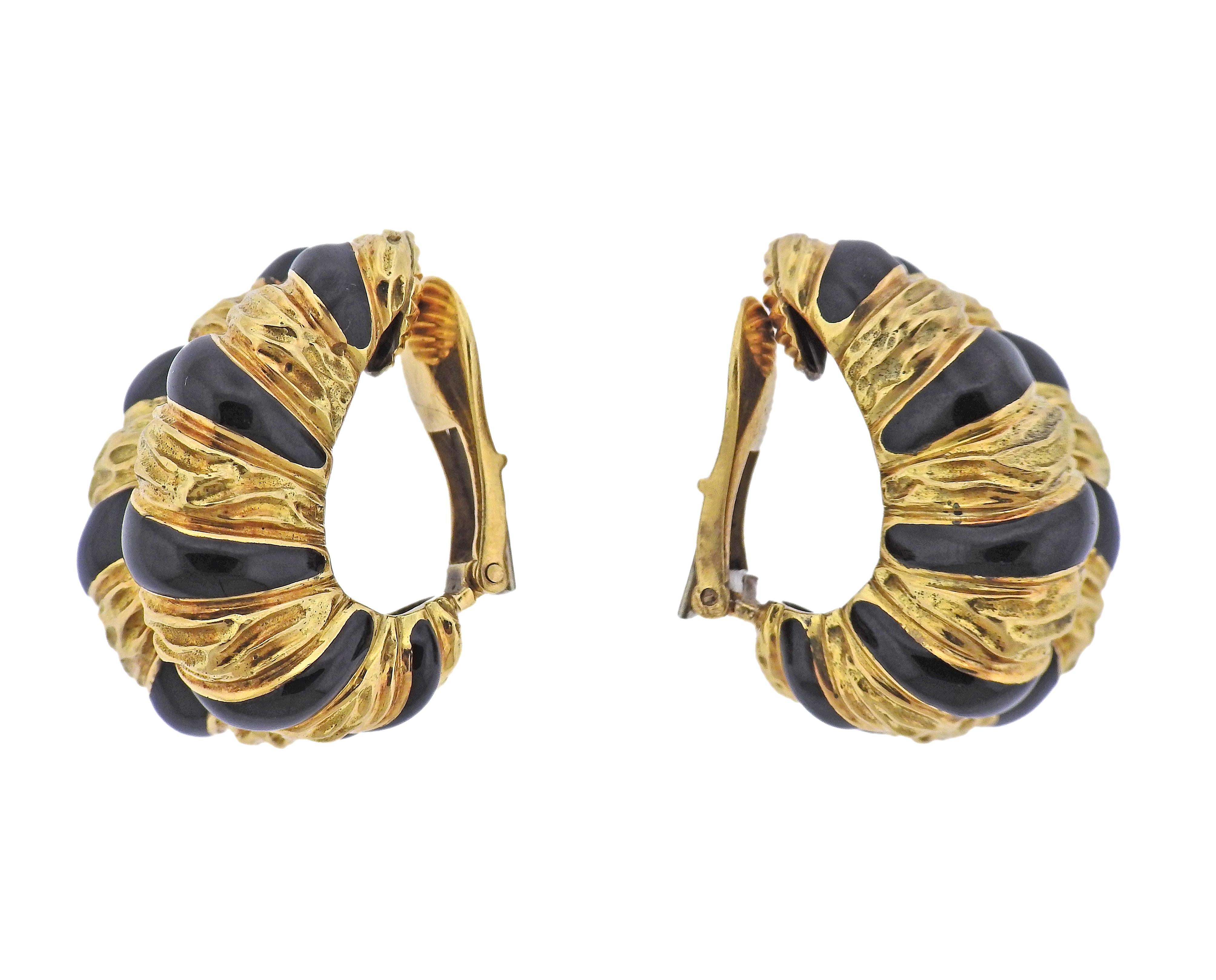 Pair of 18k gold half hop earrings by David Webb, adorned with black enamel. Earrings measure 28mm x 16mm. Marked: 18k Webb. Weight - 31.5 grams. 