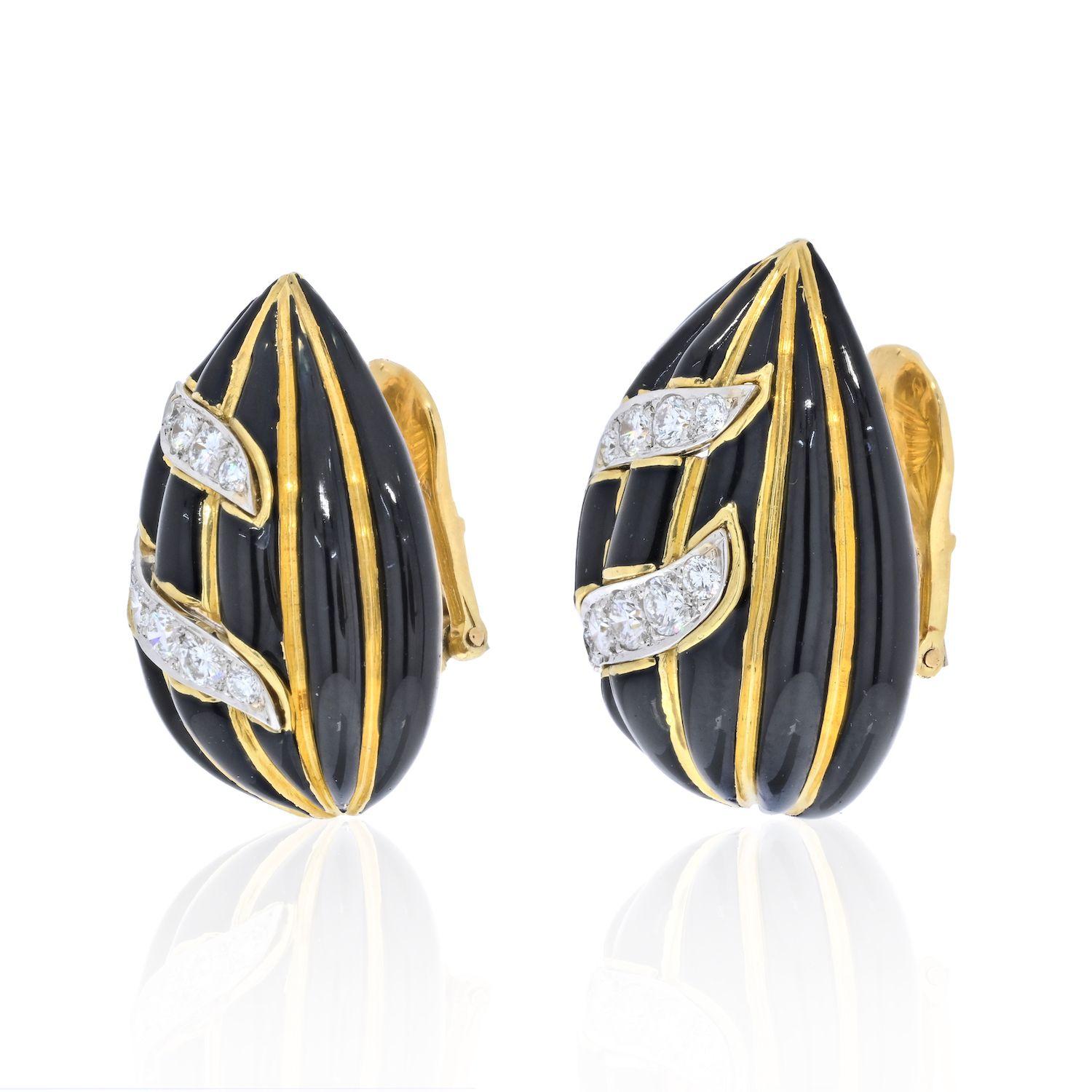 David Webb dome pear shaped clip earrings with signature Zebra stripes and diamonds. David Webb 18kt chic glossy earrings with black enamel and round cut diamonds on platinum plaques. The earrings measure approx. 30 x 22mm. and offer an omega