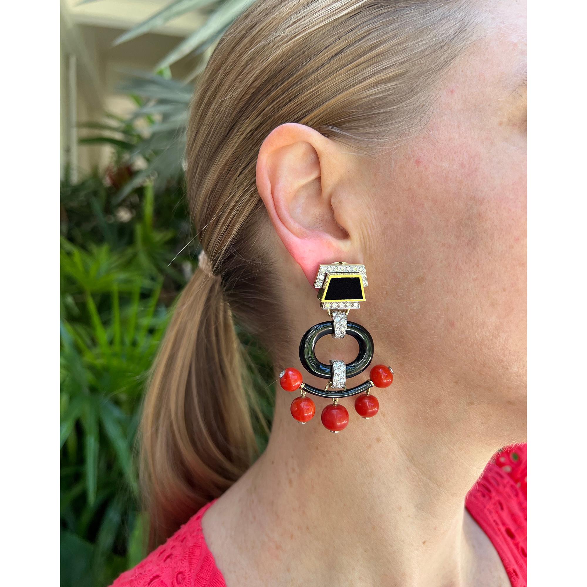 David Webb Pagoda chandelier earrings, featuring five red coral bead drops the tips of each bezel-set with a brilliant-cut diamond suspended from a black enamel decorated 18k yellow gold bar attached by diamond-set platinum links to a carved open