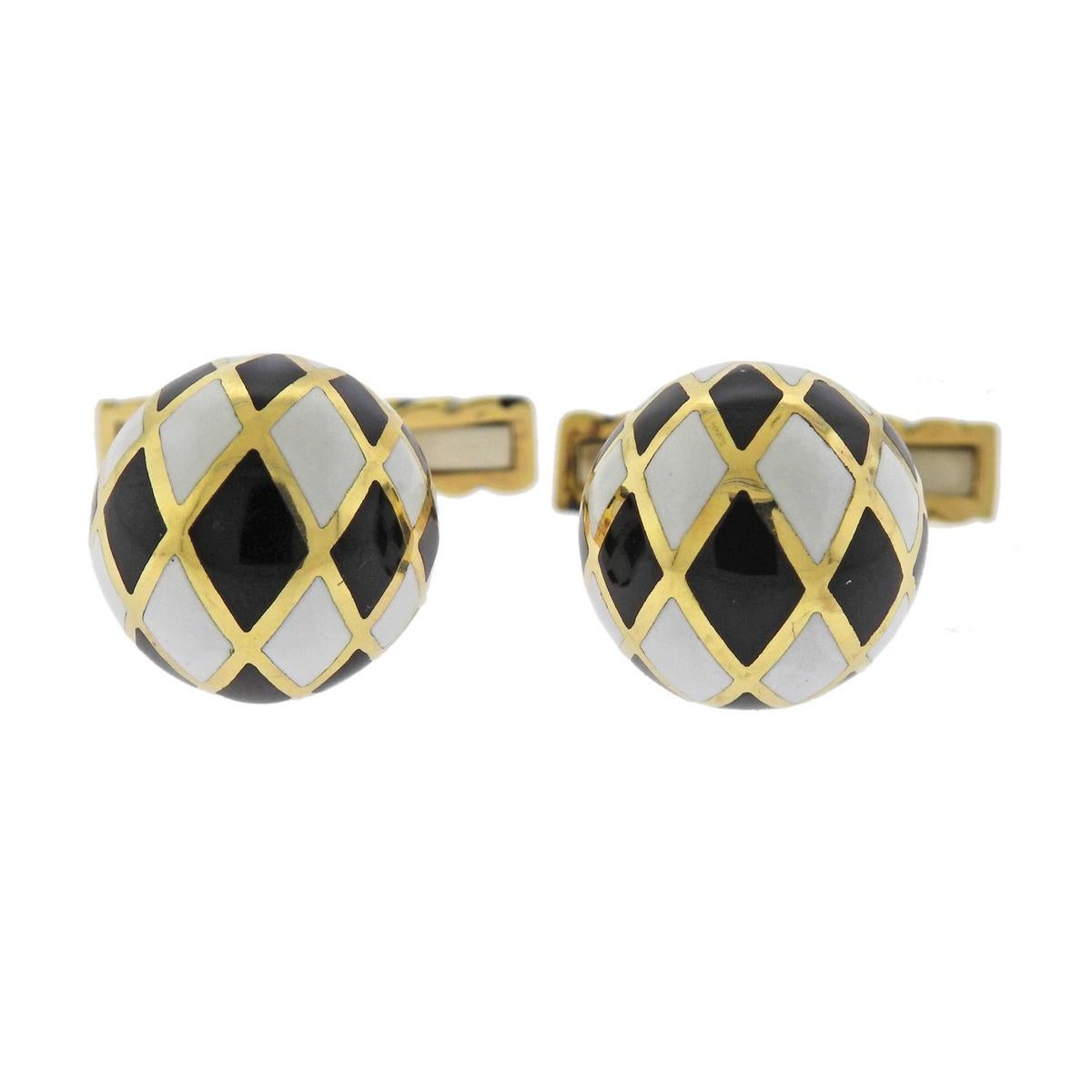 Pair of 18k yellow gold cufflinks by David Webb, set with black and white enamel top.   Cufflink top is 14.2mm in diameter, weigh 16.8 grams. Marked: Webb and 18k.