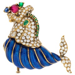 David Webb Broche coquillage en émail bleu et diamants avec épingle en forme de lion