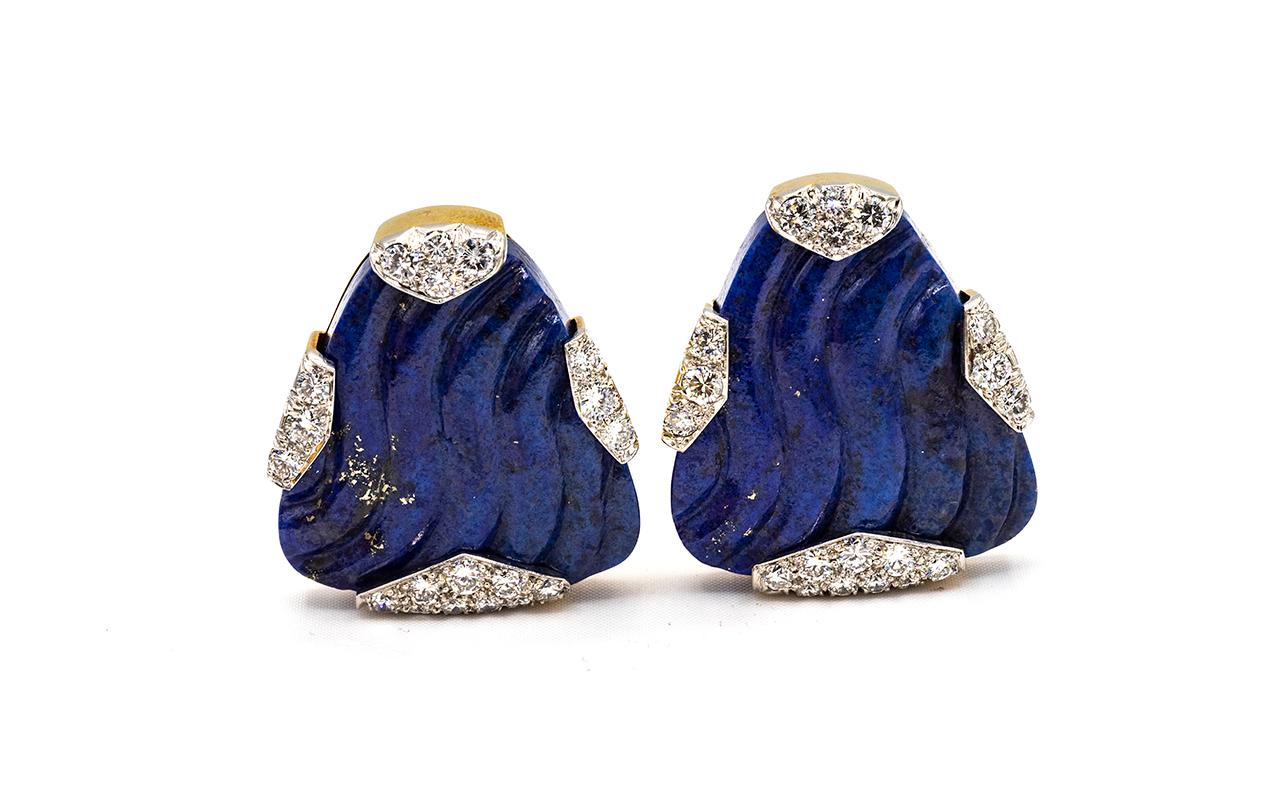 David Webb earrings made with carved lapis lazuli and round brilliant-cut diamonds.
Signed David Webb.
1970's

Platinum and 18 karat yellow gold, length approximately 1.25 inches.
Note: these earrings are heavy and are best for someone who has a