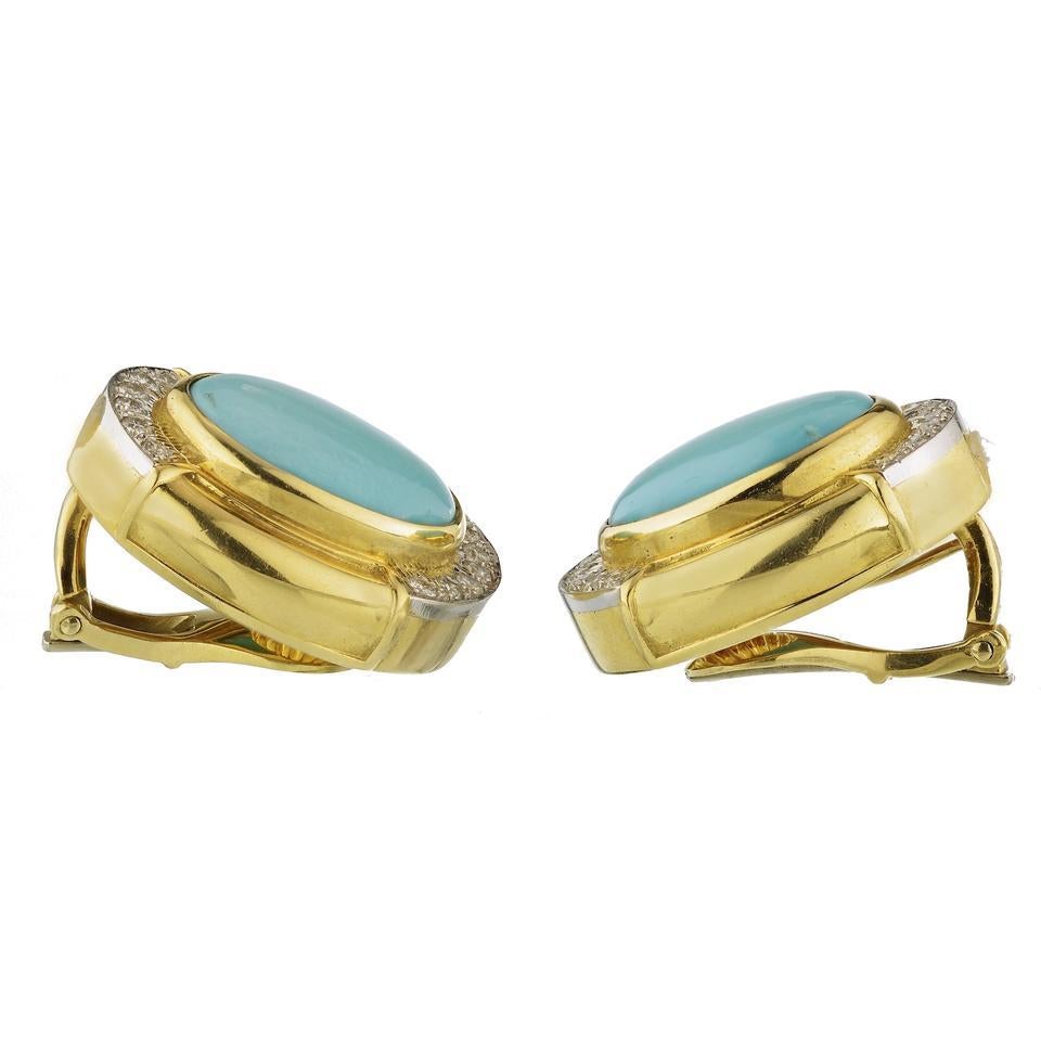 A pair of 18k gold and platinum earrings set with turquoise (16mm x 12mm) and approximately 0.48ctw of H/VS diamonds. The earrings measure 25mm x 20mm and weigh 30.3 grams. Marked: 900pt, 18k, Webb.

DESIGNER: David Webb
MATERIAL: 18k Gold,