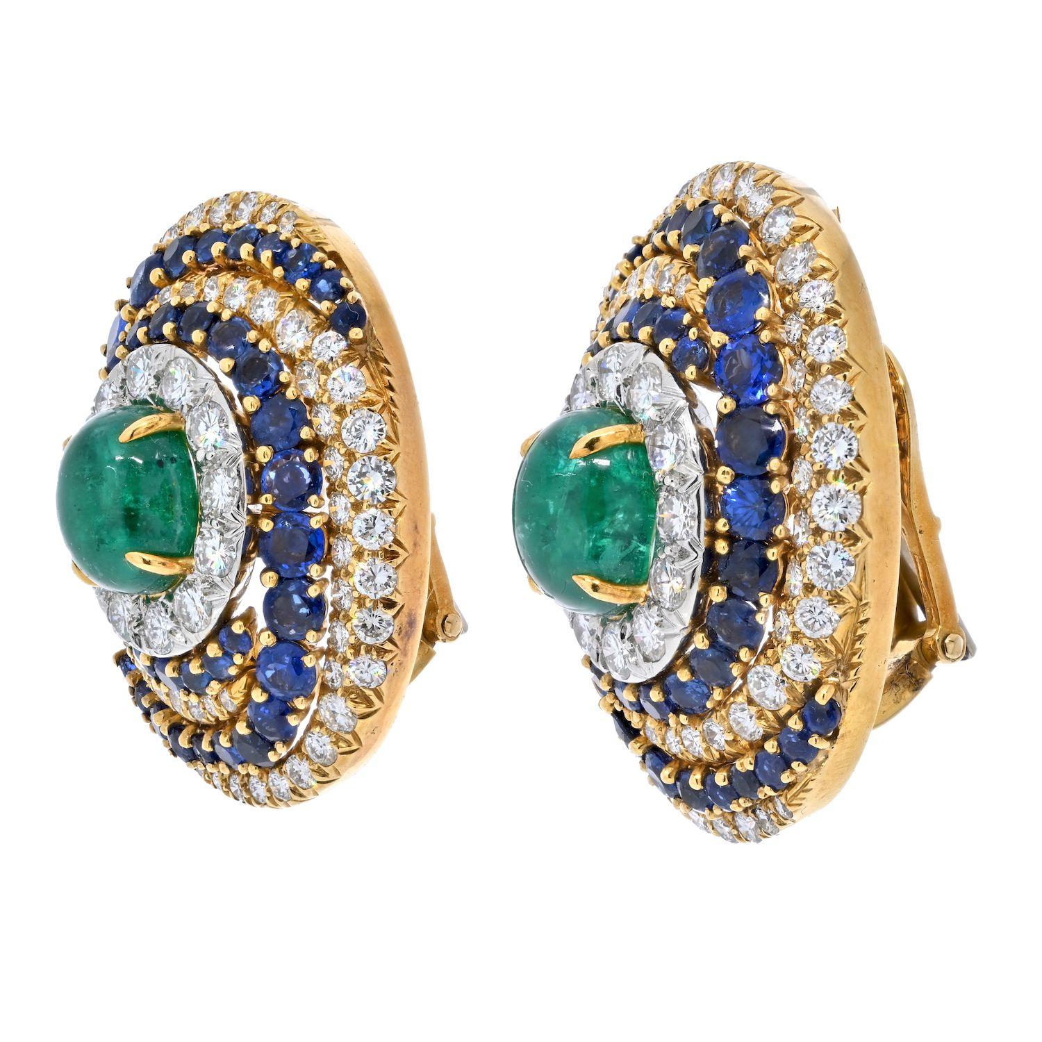 David Webb diamond, emerald and sapphire earrings of a bombe design. These highly decorated bombe earrings feature 10.15cts of green emeralds, 10.39 in sapphires and 7 carats of dimaonds. They fasten by a heavy clip back and stay put on the ear. The